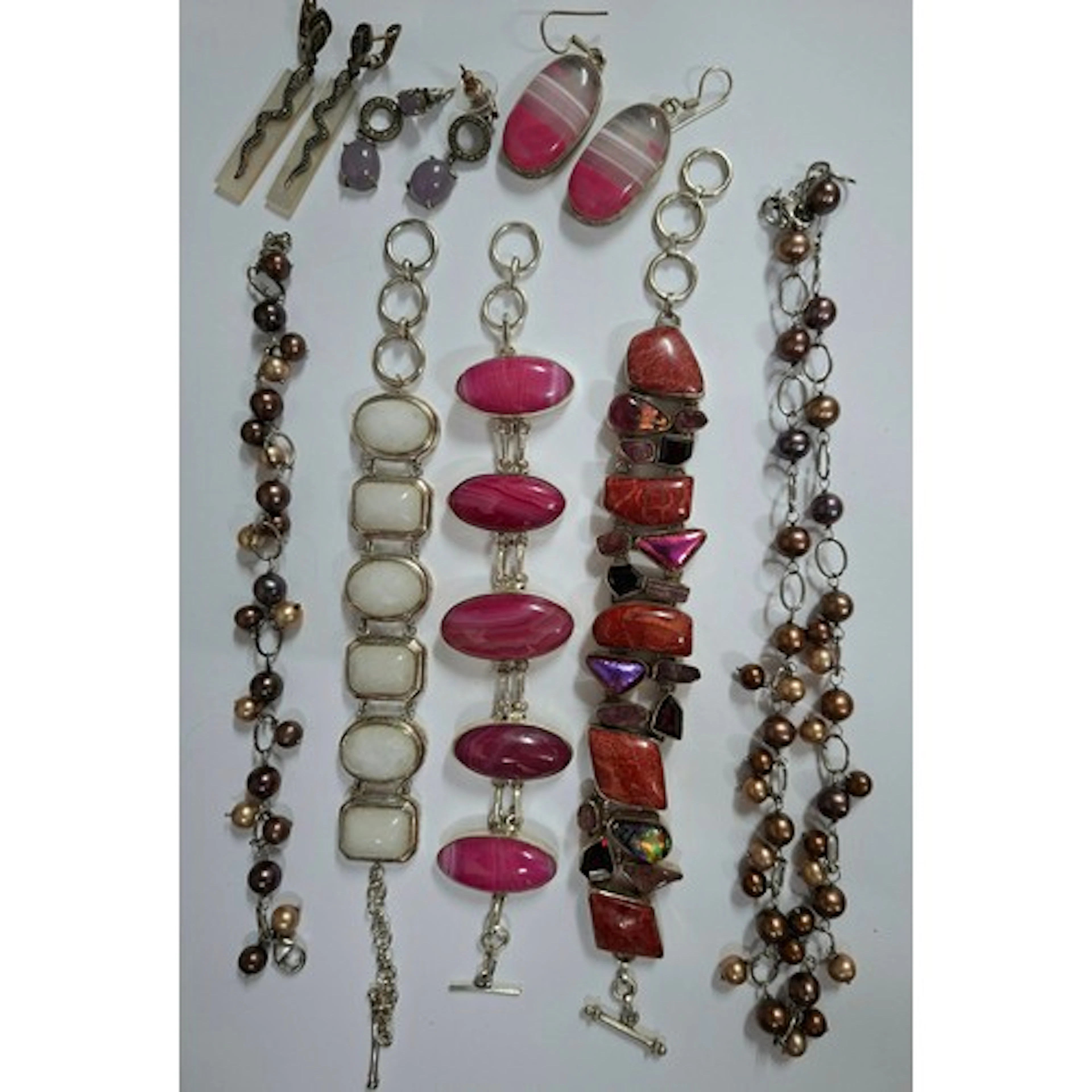 White metal and silver coloured bracelets with inset stones ...
