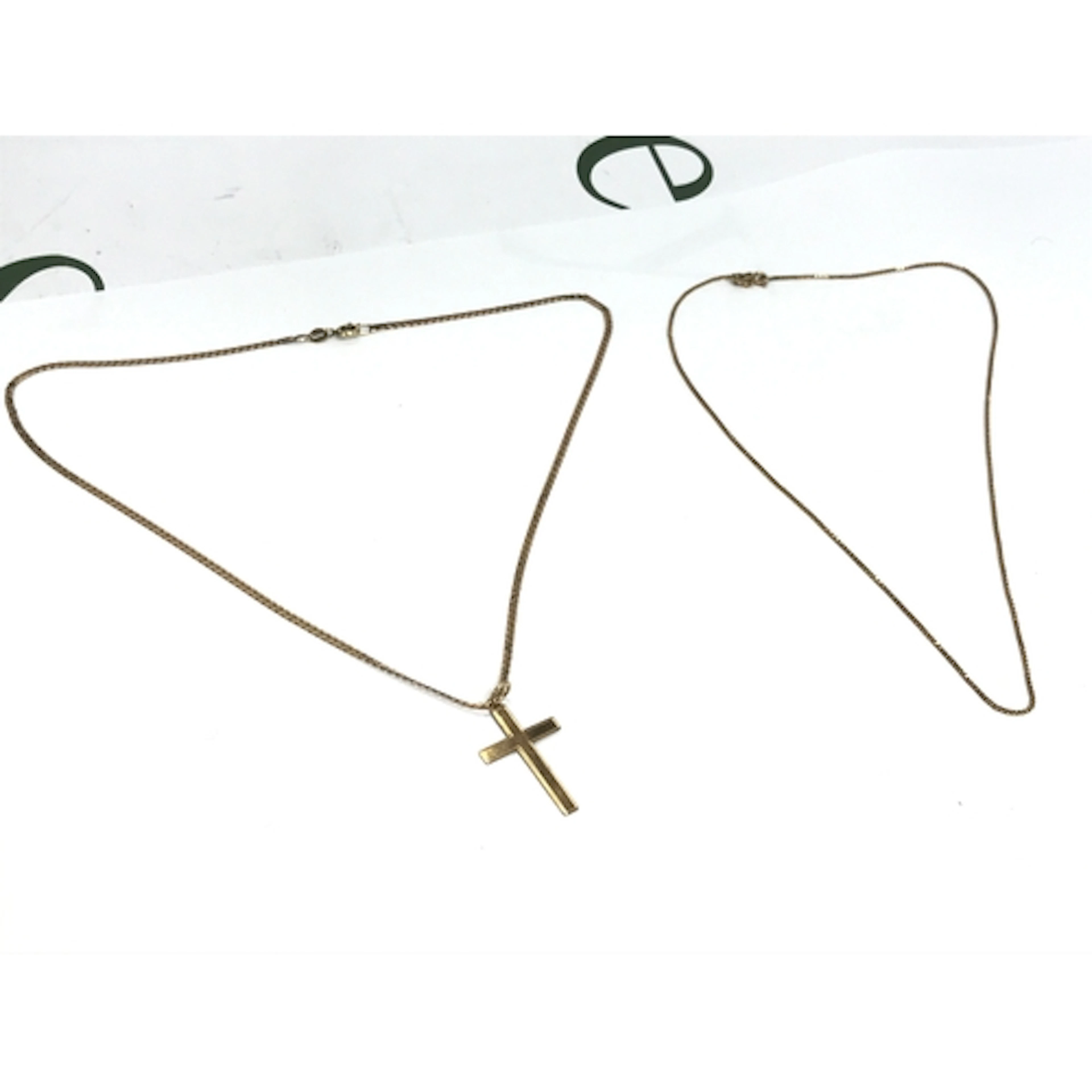 A thin 9ct gold chain (19cm long) and a 9ct gold chain (22cm...