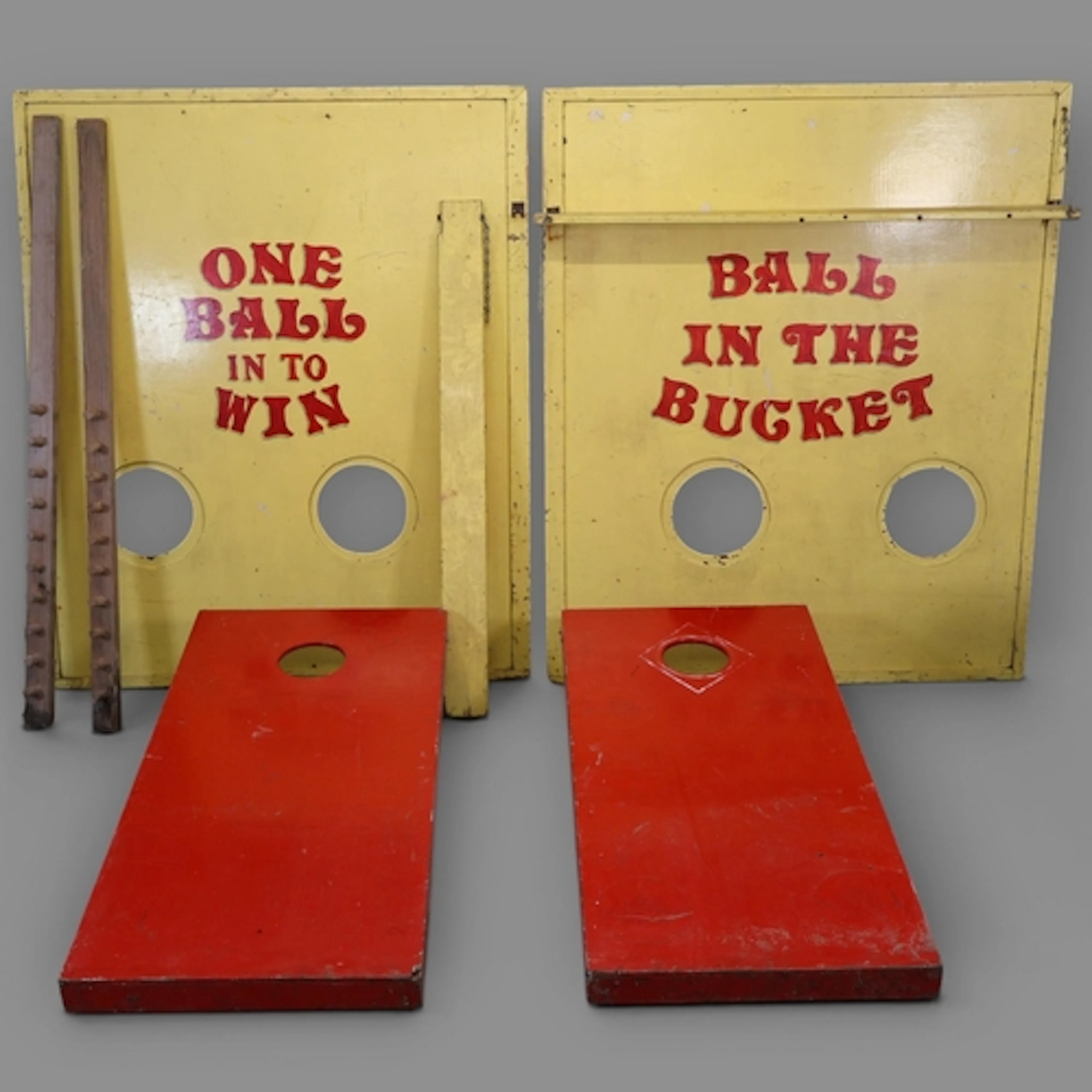 Carnival interest - A painted wooden ball in a bucket game c...