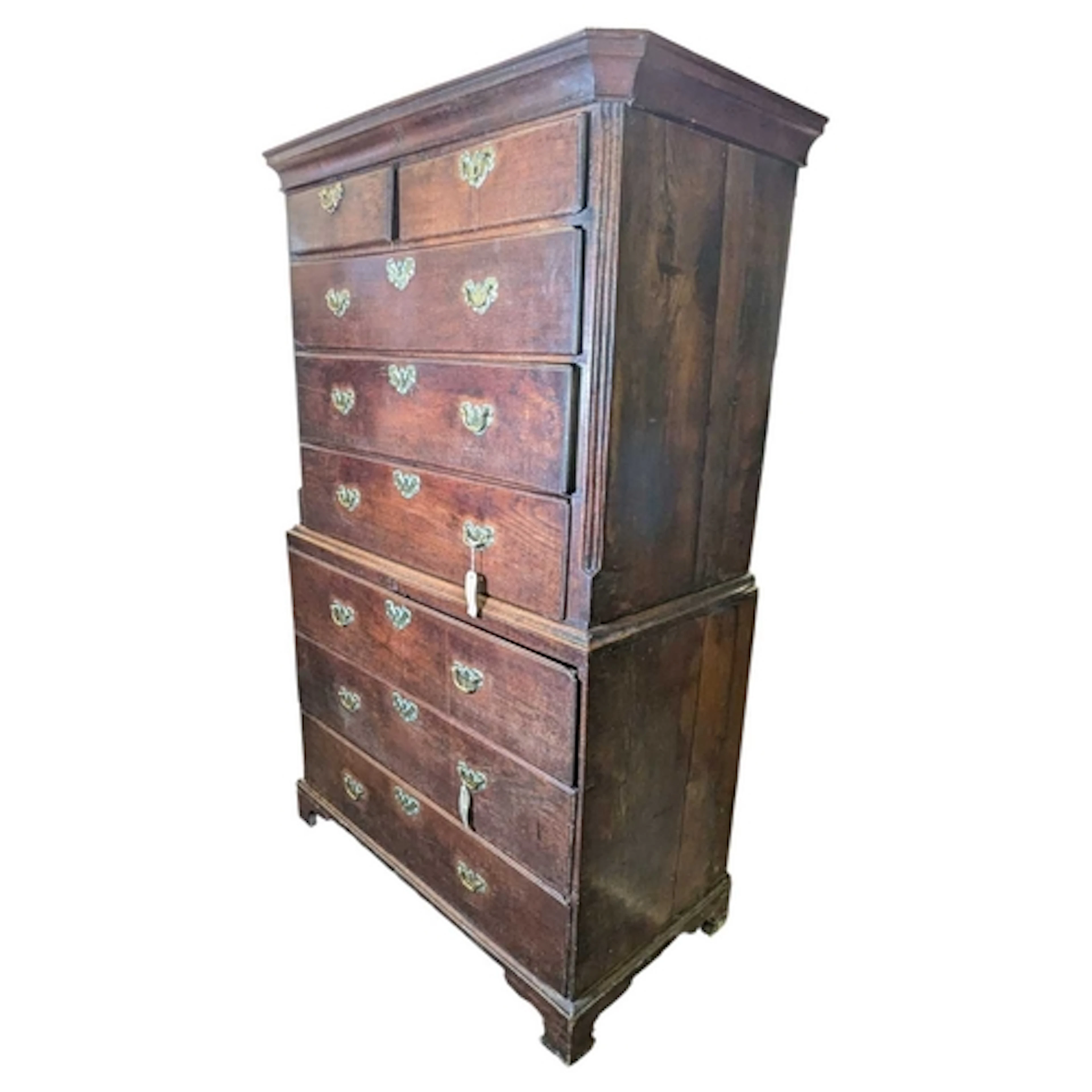 A 19th century George III oak chest on chest of drawers. Rai...