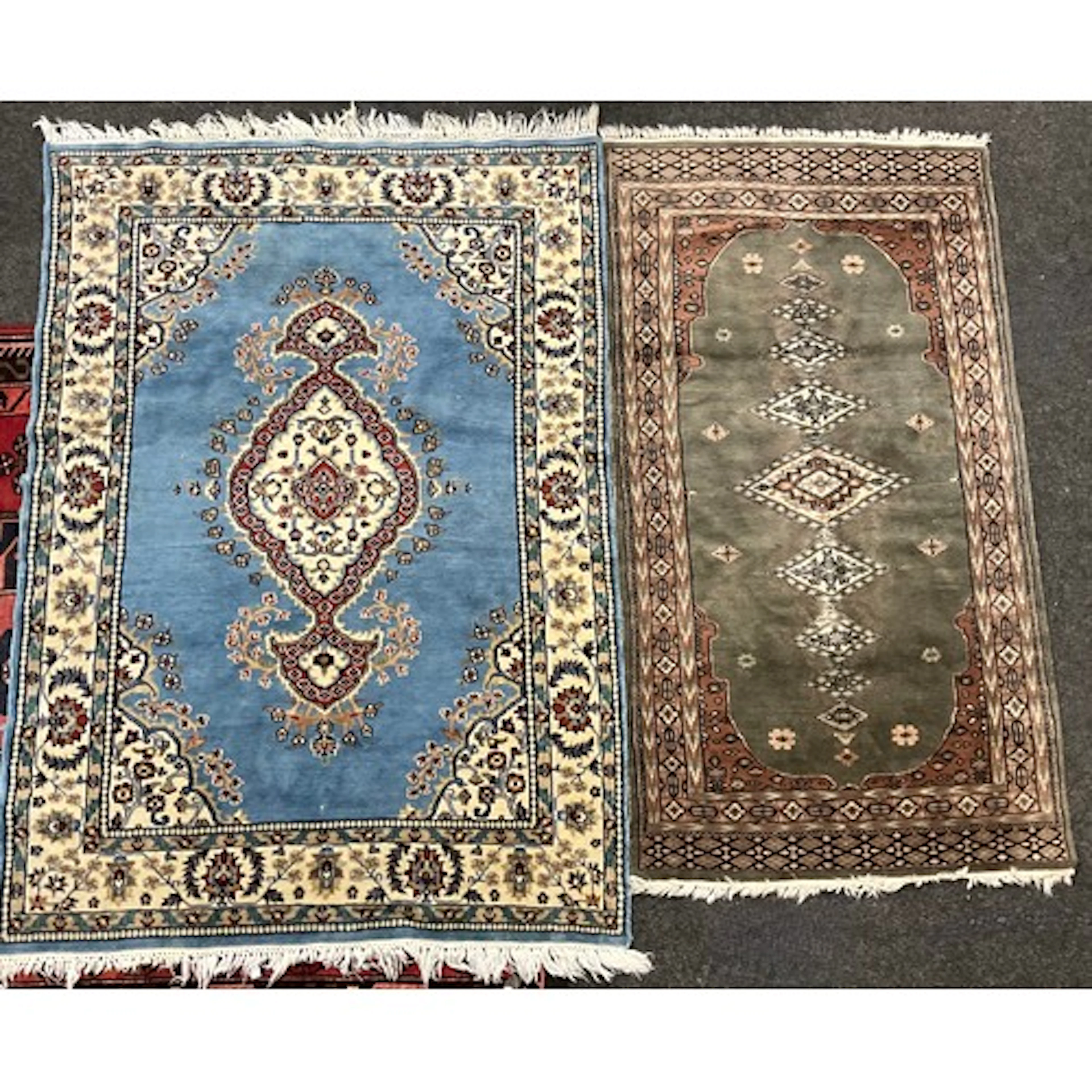 A Persian rug, central floral medallion within blue field, t...