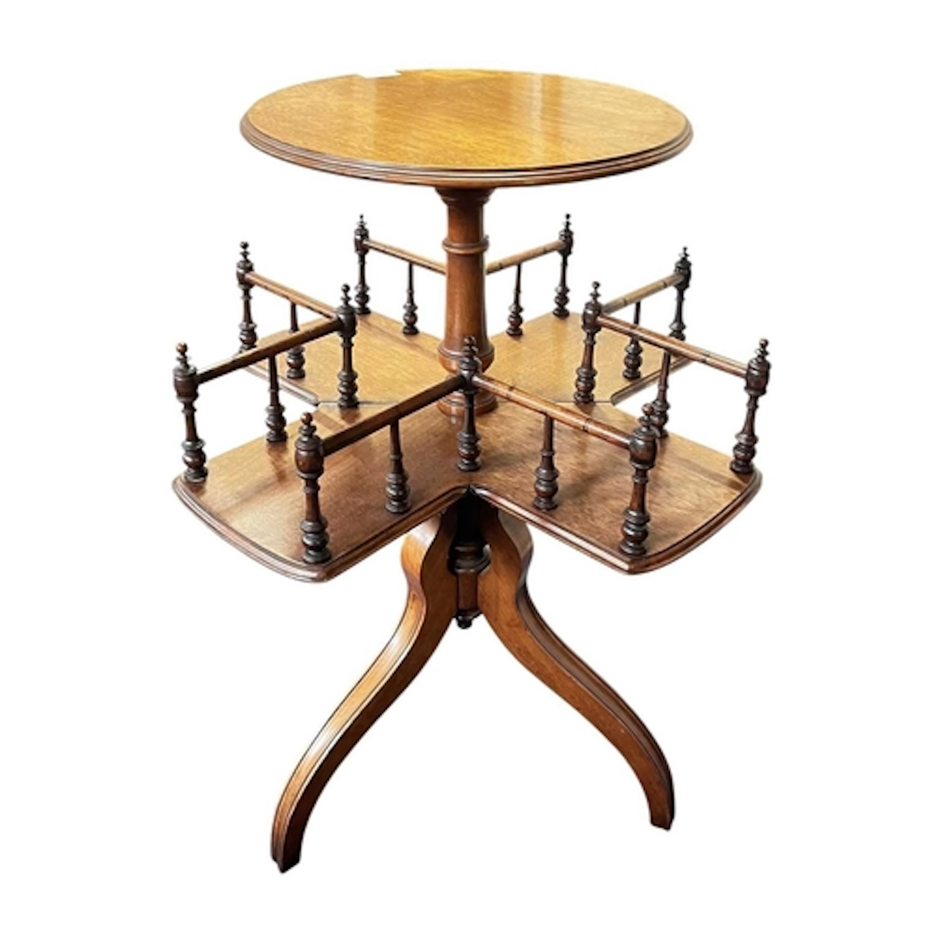 A 19th century walnut revolving pedestal book table. The tab...
