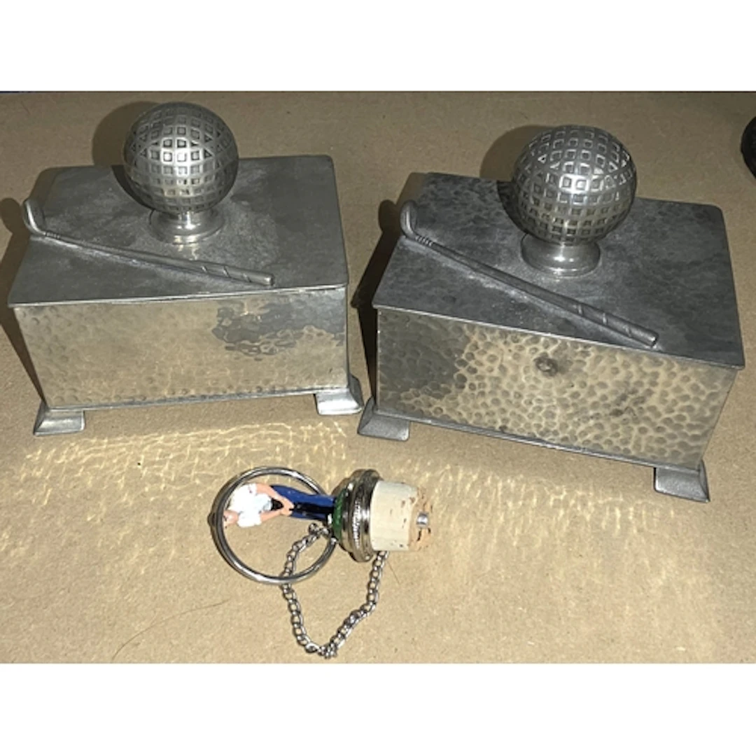 Two Art Deco style pewter boxes with golf ball and club deco...