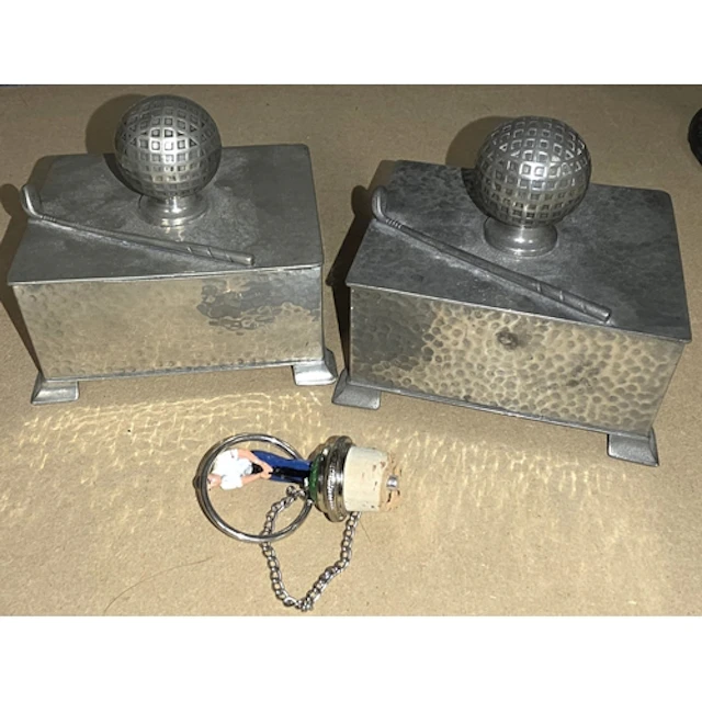 Two Art Deco style pewter boxes with golf ball and club deco...
