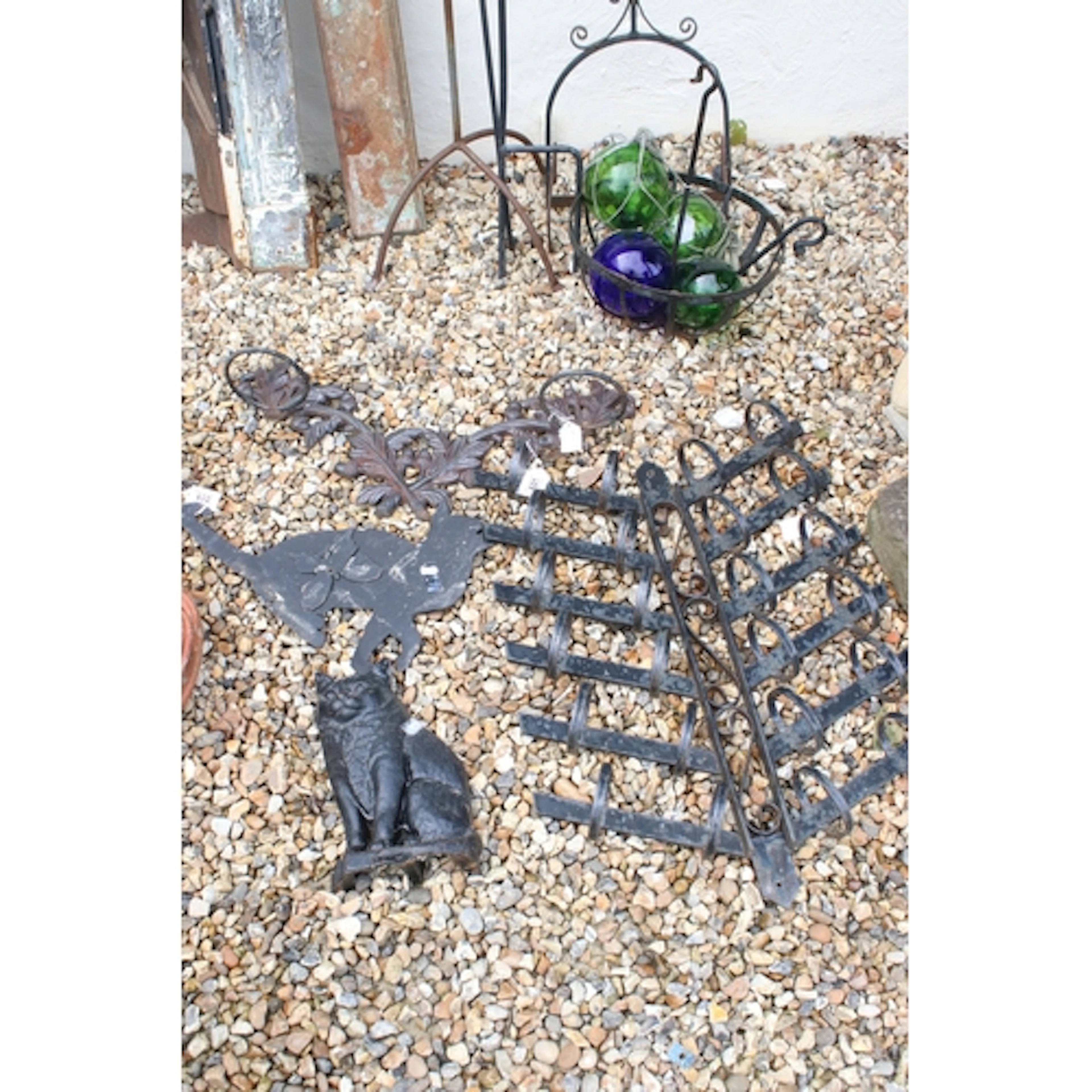 Collection of cast iron garden accessories, comprising: a ca...