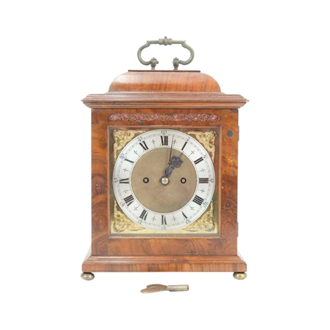 A Charles II style walnut table clock. Early 20th century, t...