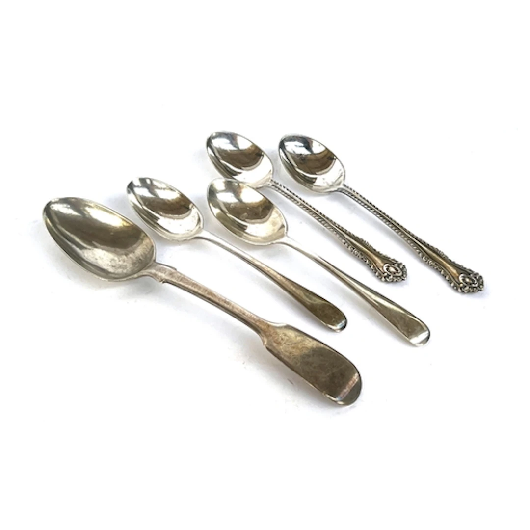A Victorian fiddle pattern silver teaspoon; together with tw...