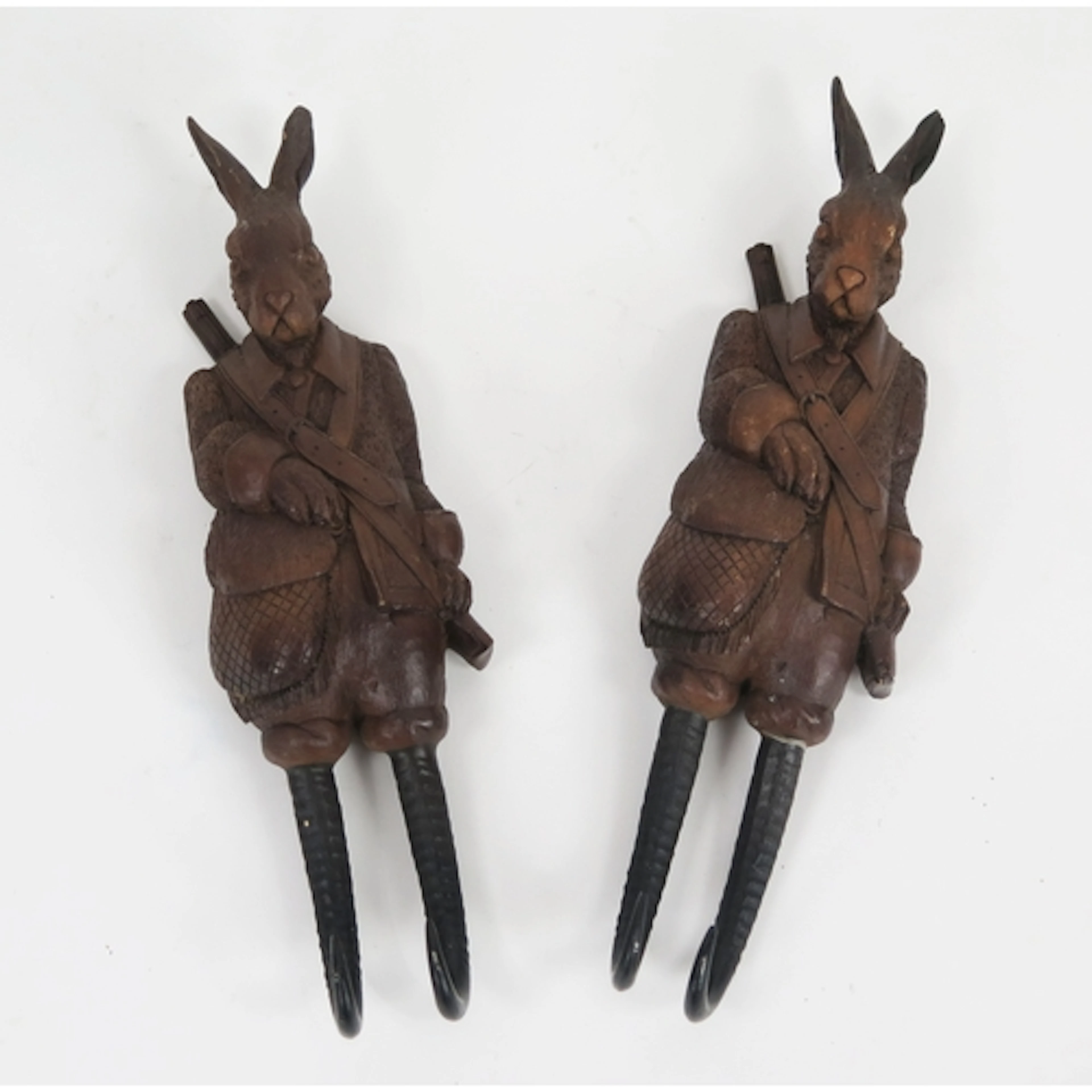 Pair of Reproduction black forest style novelty hare coat ho...