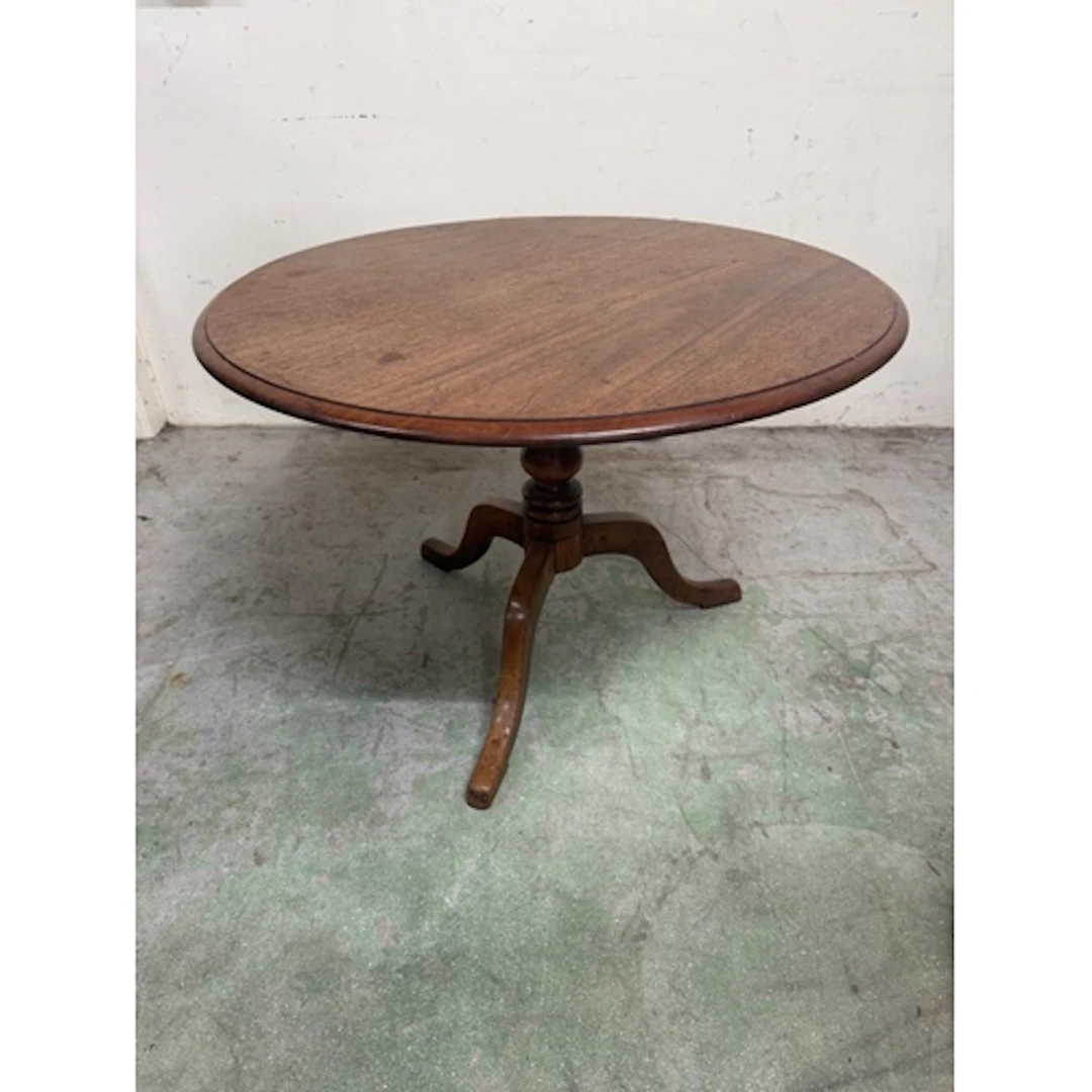 A mahogany tilt topped pedestal table on splayed legs