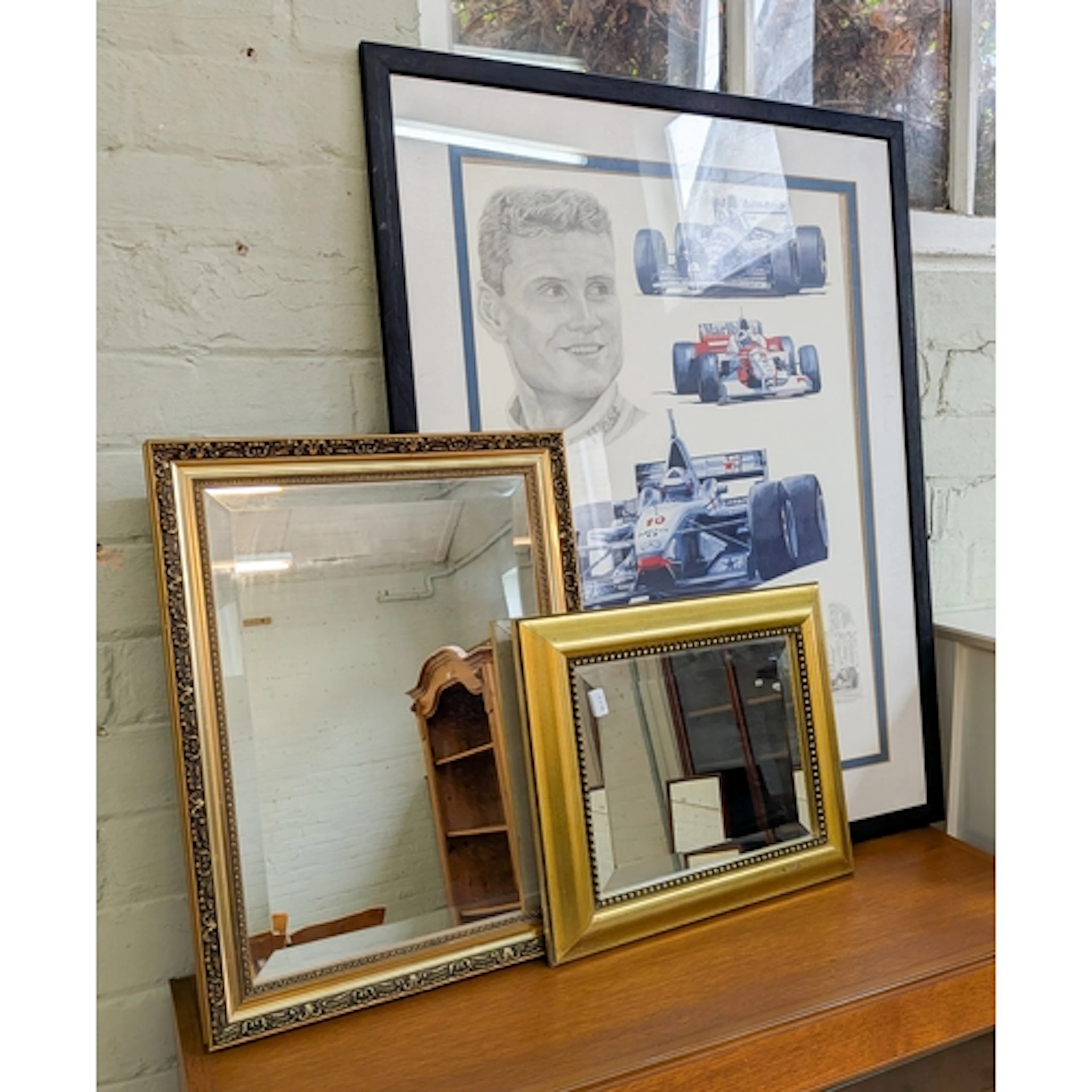 A framed David Coulthard car racing print together with two ...