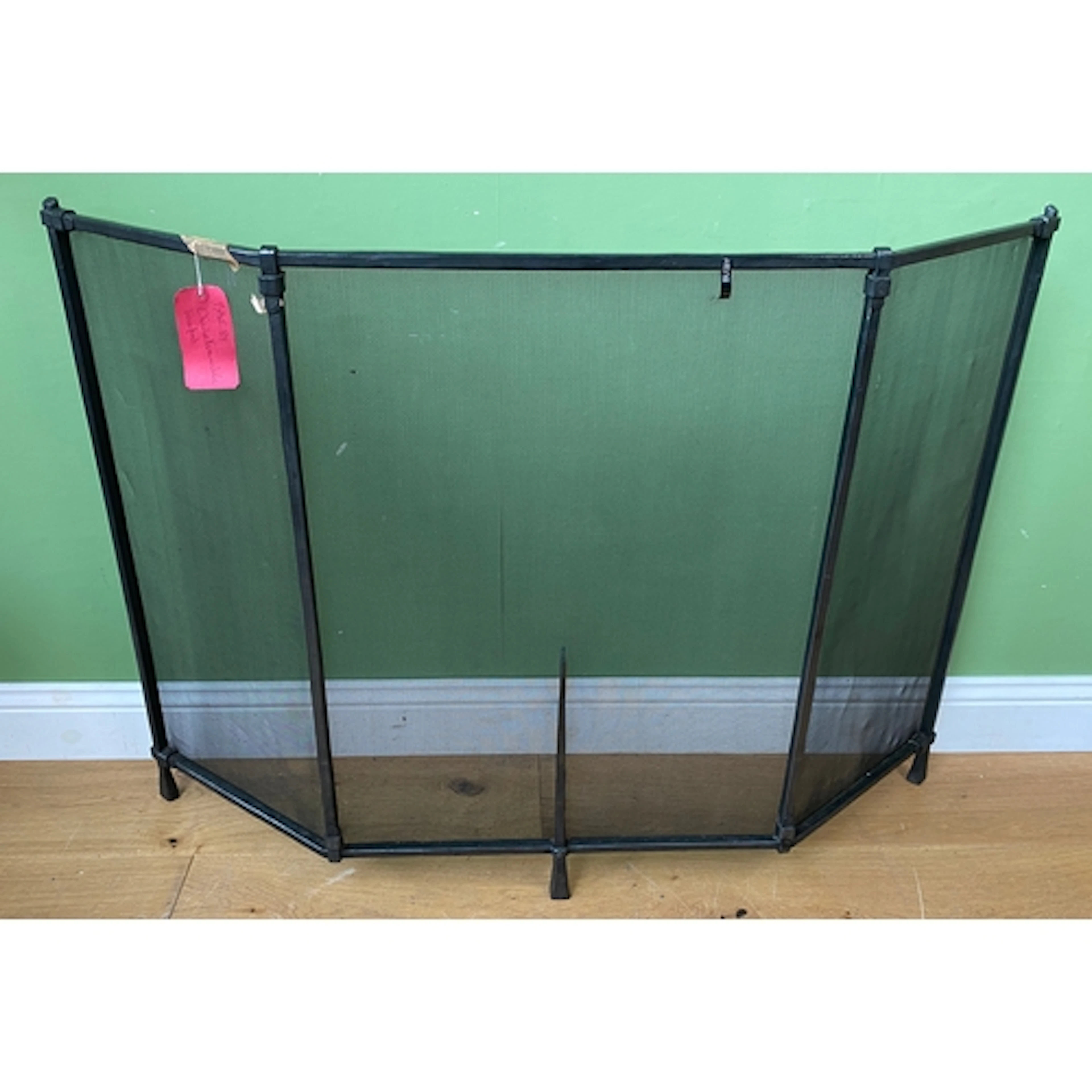 A large wrought iron and mesh fire screen, 130cmW 93cmH