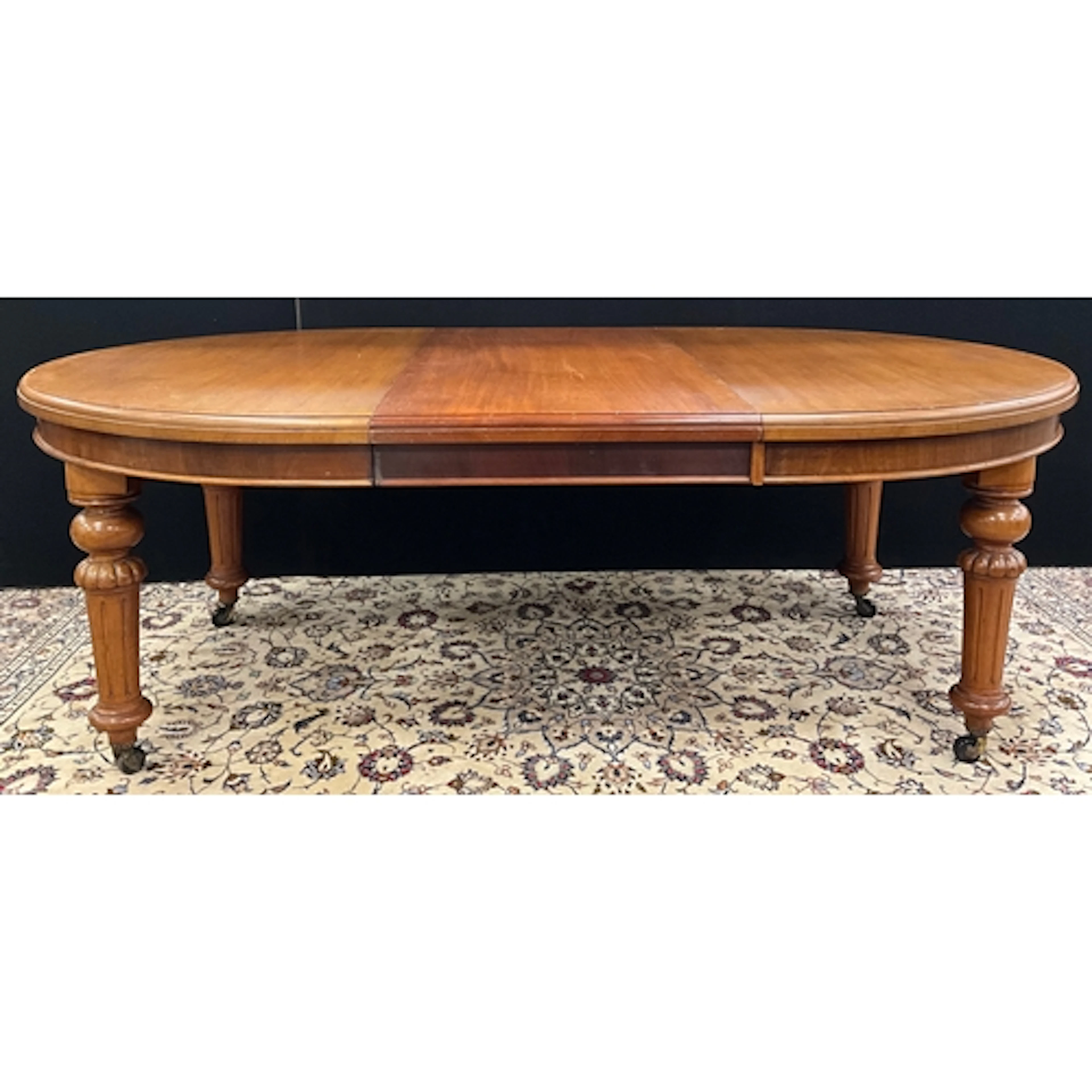 A Victorian mahogany wind-out extending dining table, oval t...