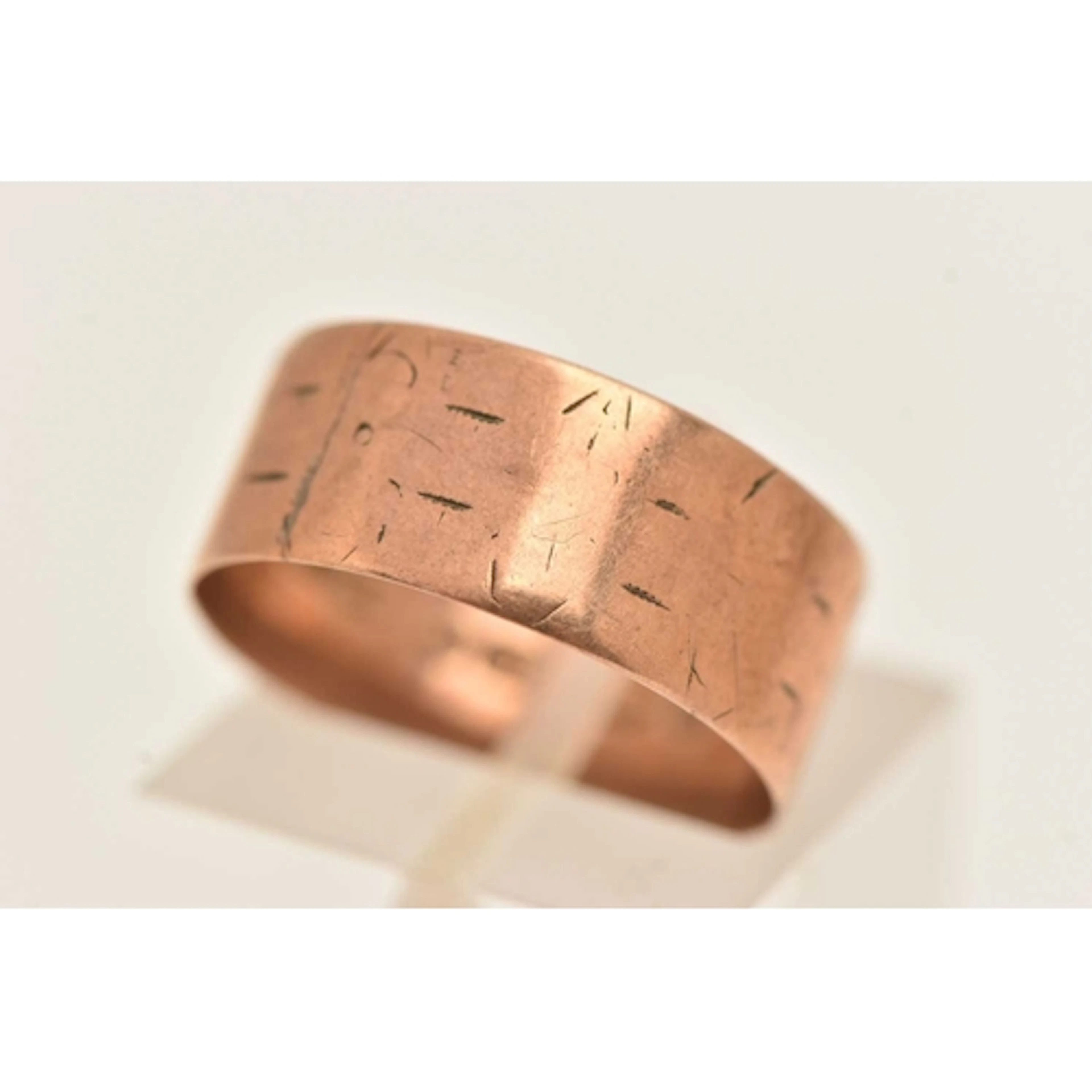 A WIDE 9CT ROSE GOLD BAND RING, worn pattern, hallmarked 9ct...
