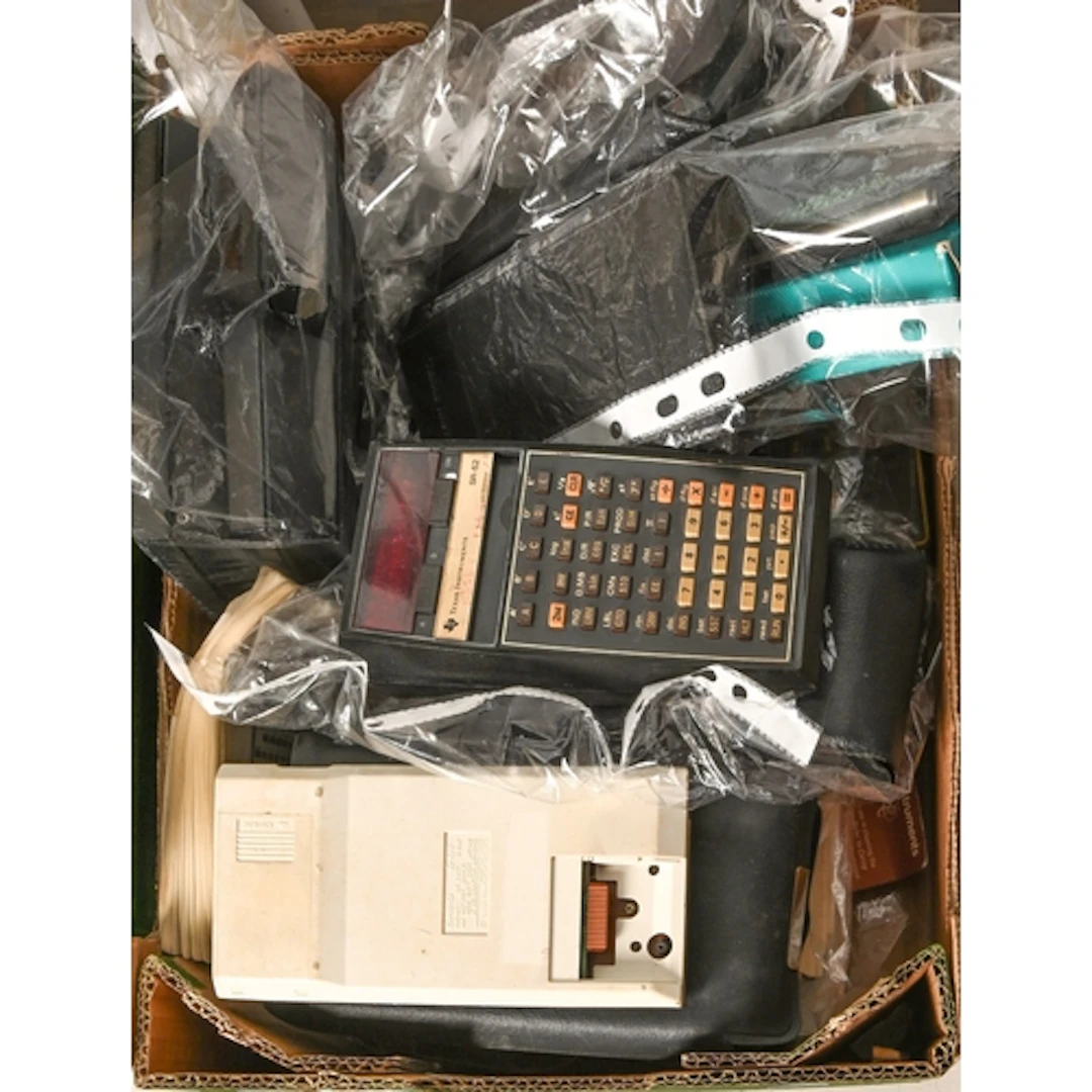Twelve Texas Instruments and six Hewlett Packard calculators...