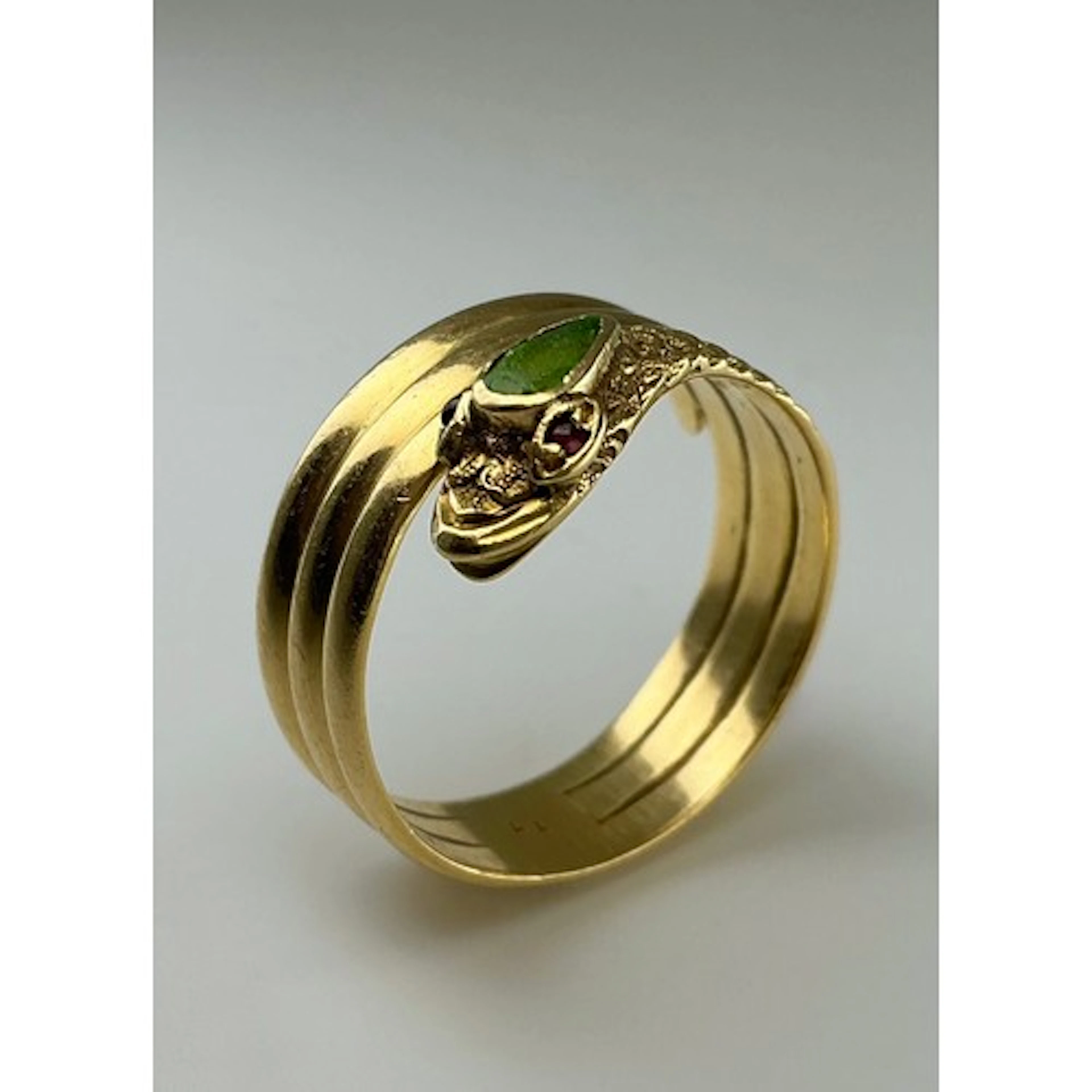 A Victorian 18ct gold serpent ring, with emerald and ruby ac...