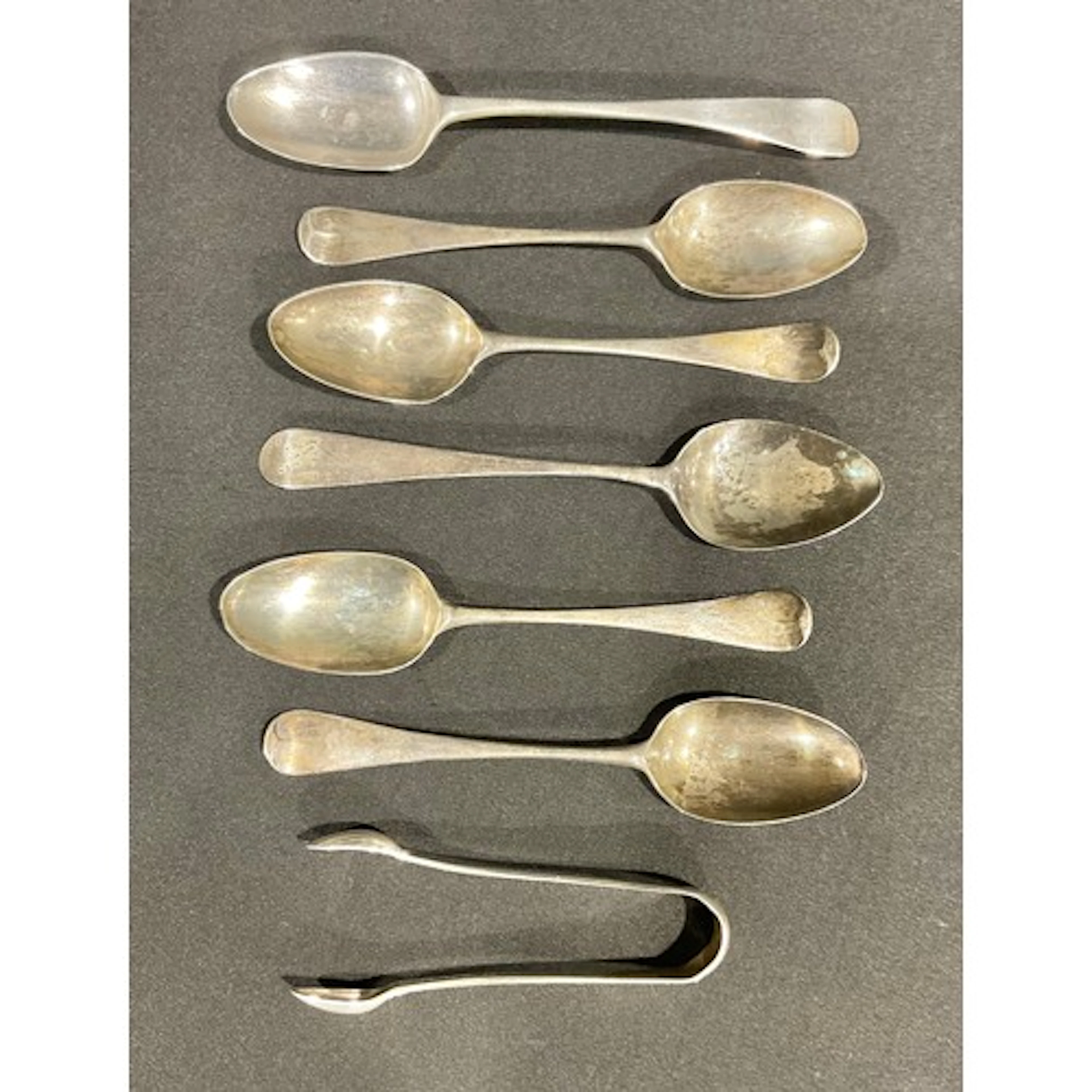 A set of four George II/III silver teaspoons, each bowl chas...