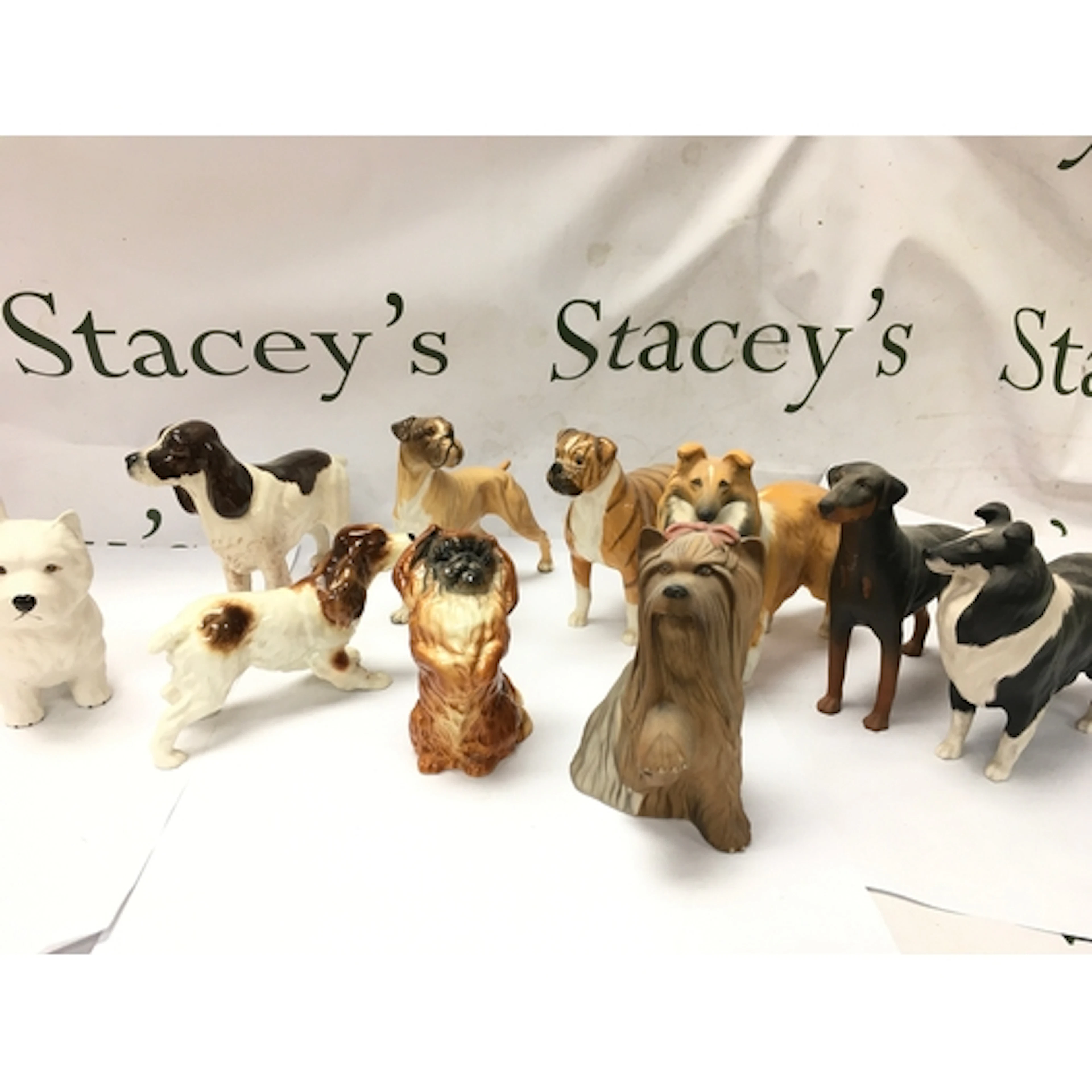 vintage ceramic and porcelain dog figurines, including breed...