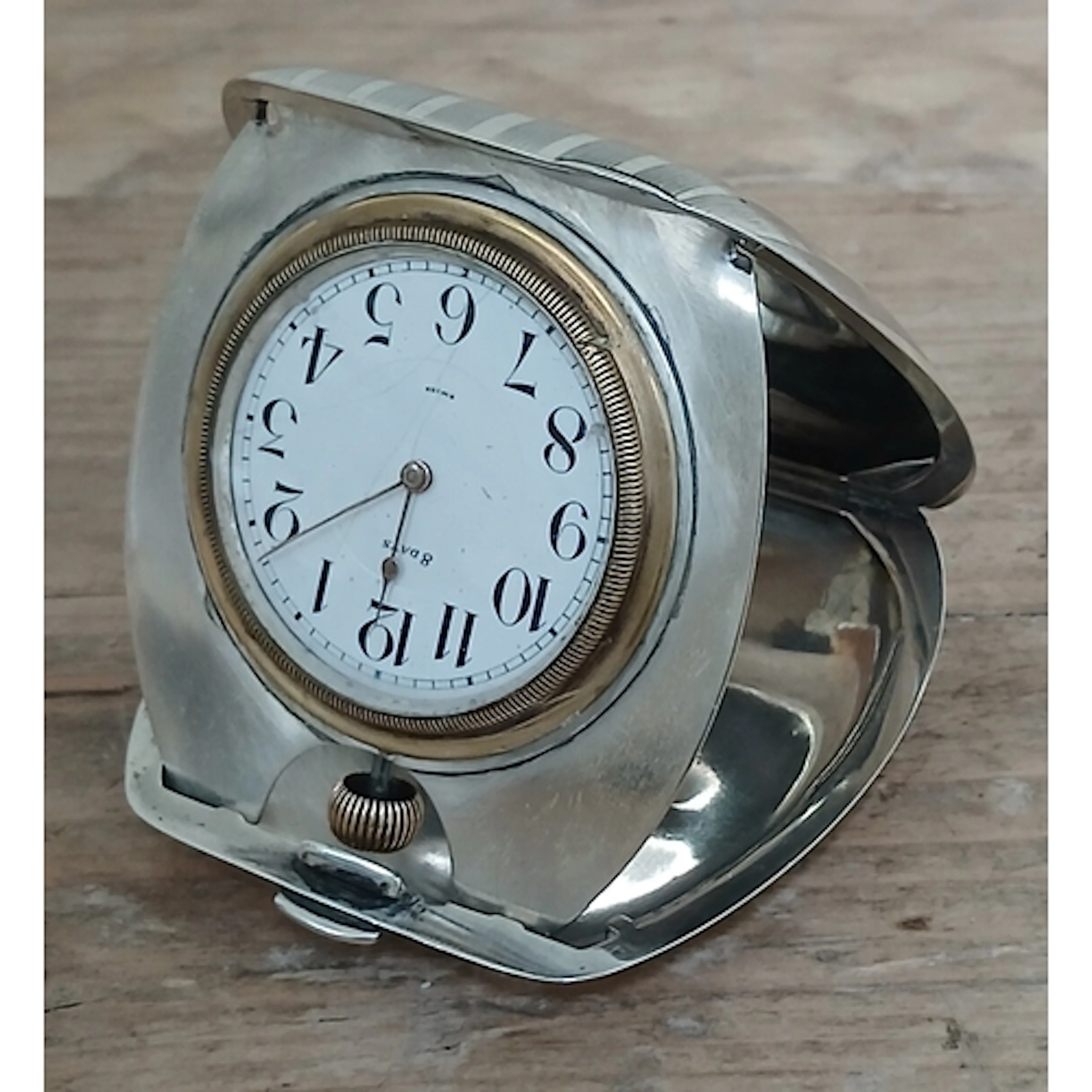 A fold out 8 day desk clock, marked 'Tiffany & Co' and 'Ster...