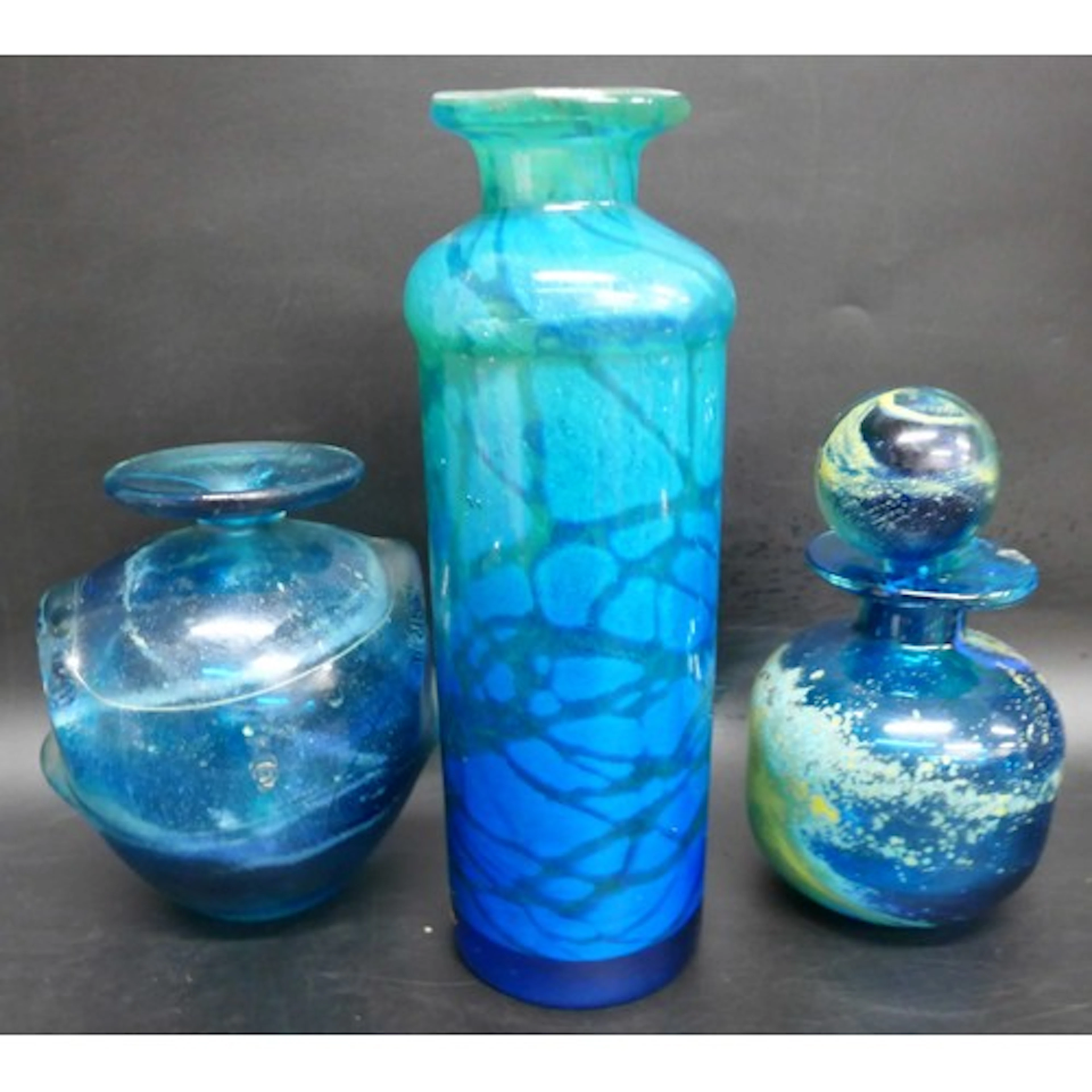 Three pieces of Mdina studio glass consisting of two vases a...