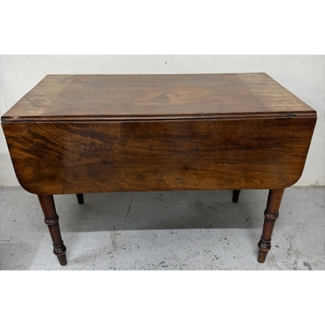 A Regency mahogany Pembroke table on turned legs with drawer...