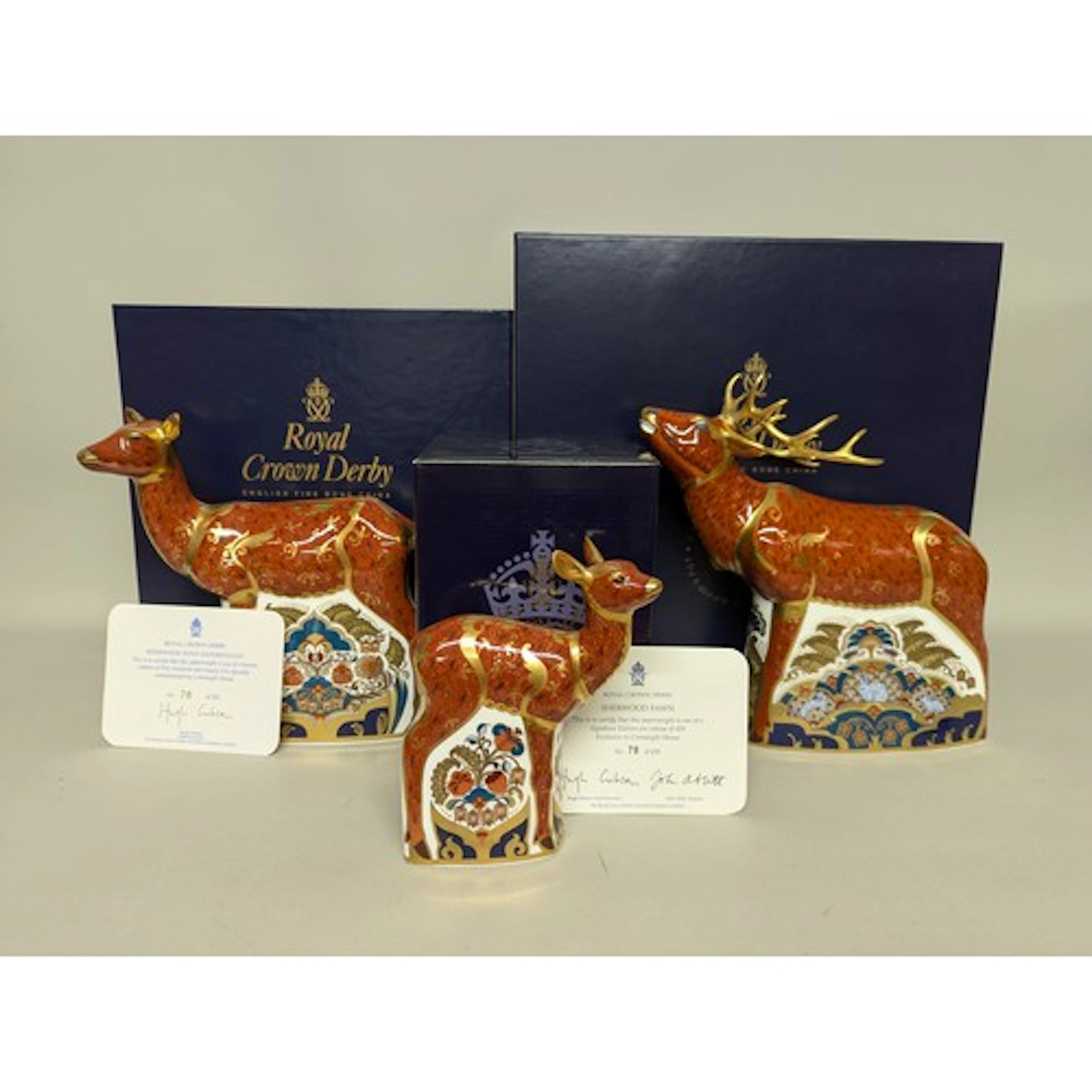 A Royal Crown Derby paperweight family group, The Sherwood C...