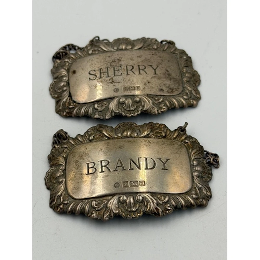 Two silver decanter labels 'Brandy' and 'Sherry' hallmarked ...