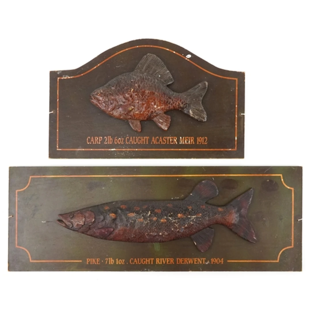Two decorative carved wood fishing interest plaques comprisi...