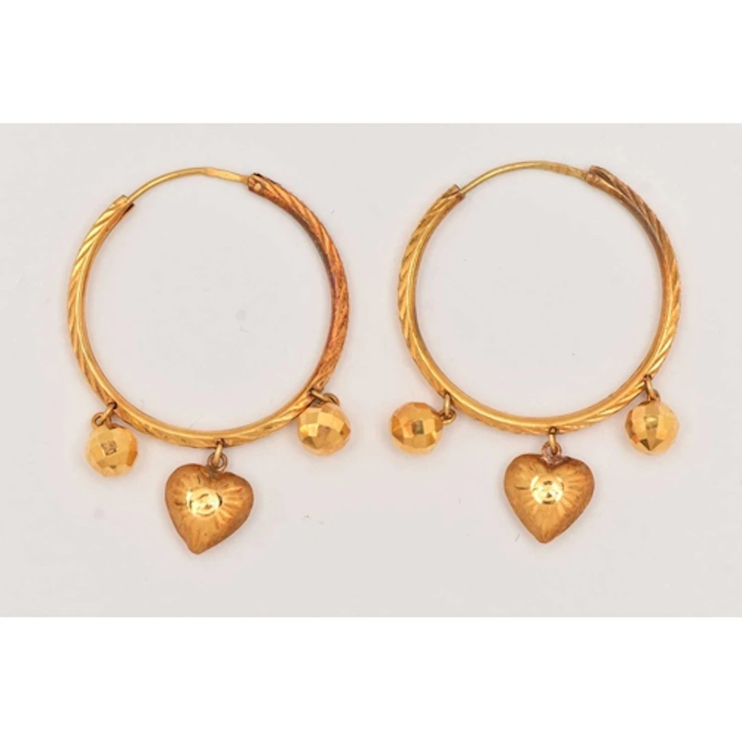 A PAIR OF YELLOW METAL HOOP EARRINGS, textured hoops attache...