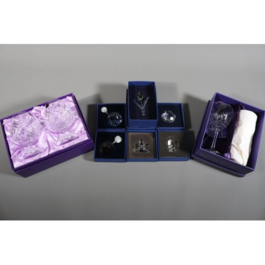 Five Swarovski glass items including a tulip, a shell, a flo...