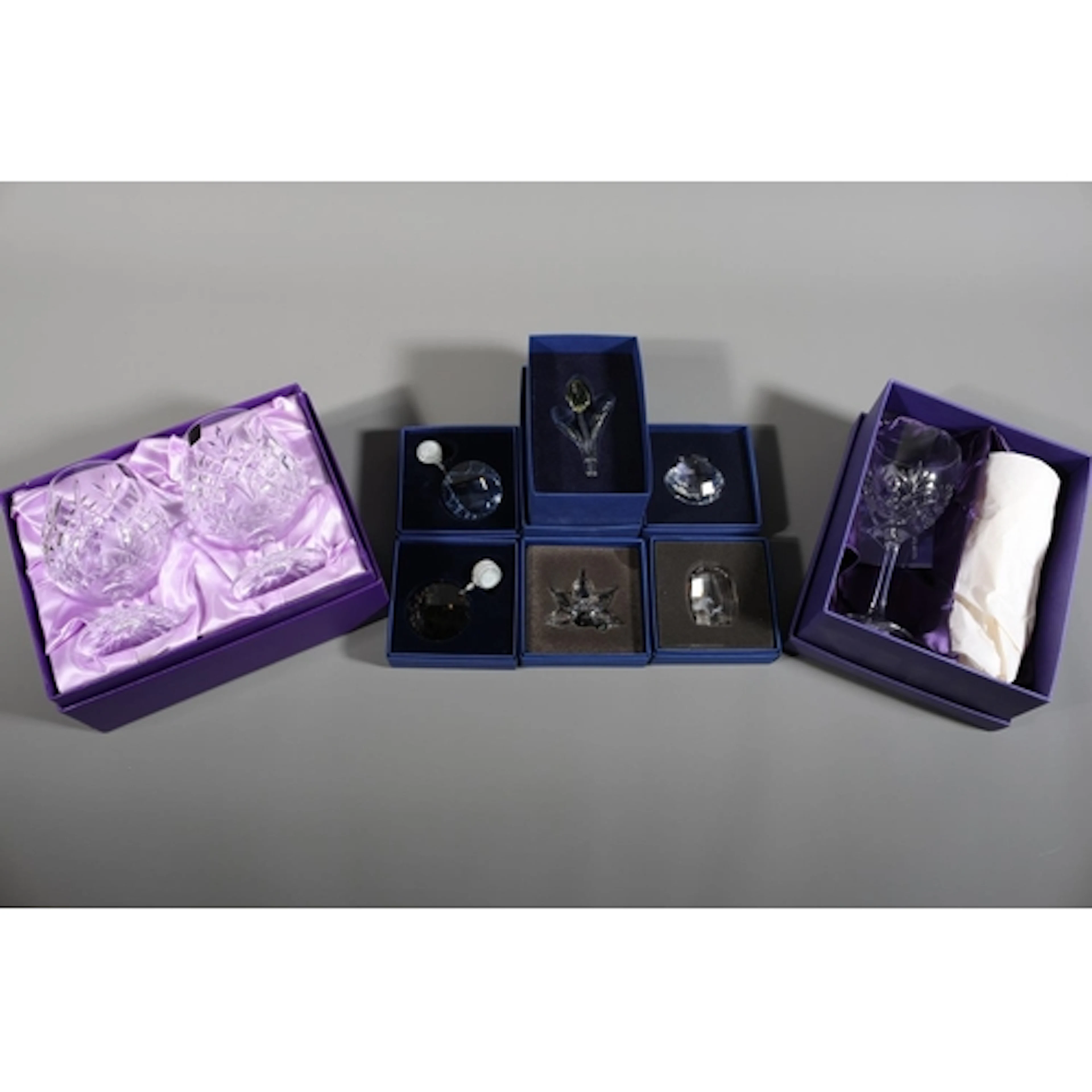 Five Swarovski glass items including a tulip, a shell, a flo...