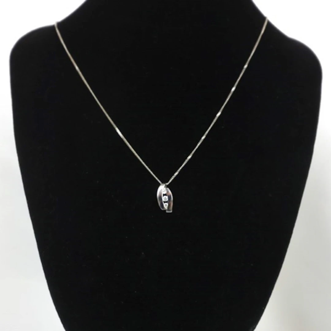 A contemporary 9ct white gold pendant, the openwork pendant ...