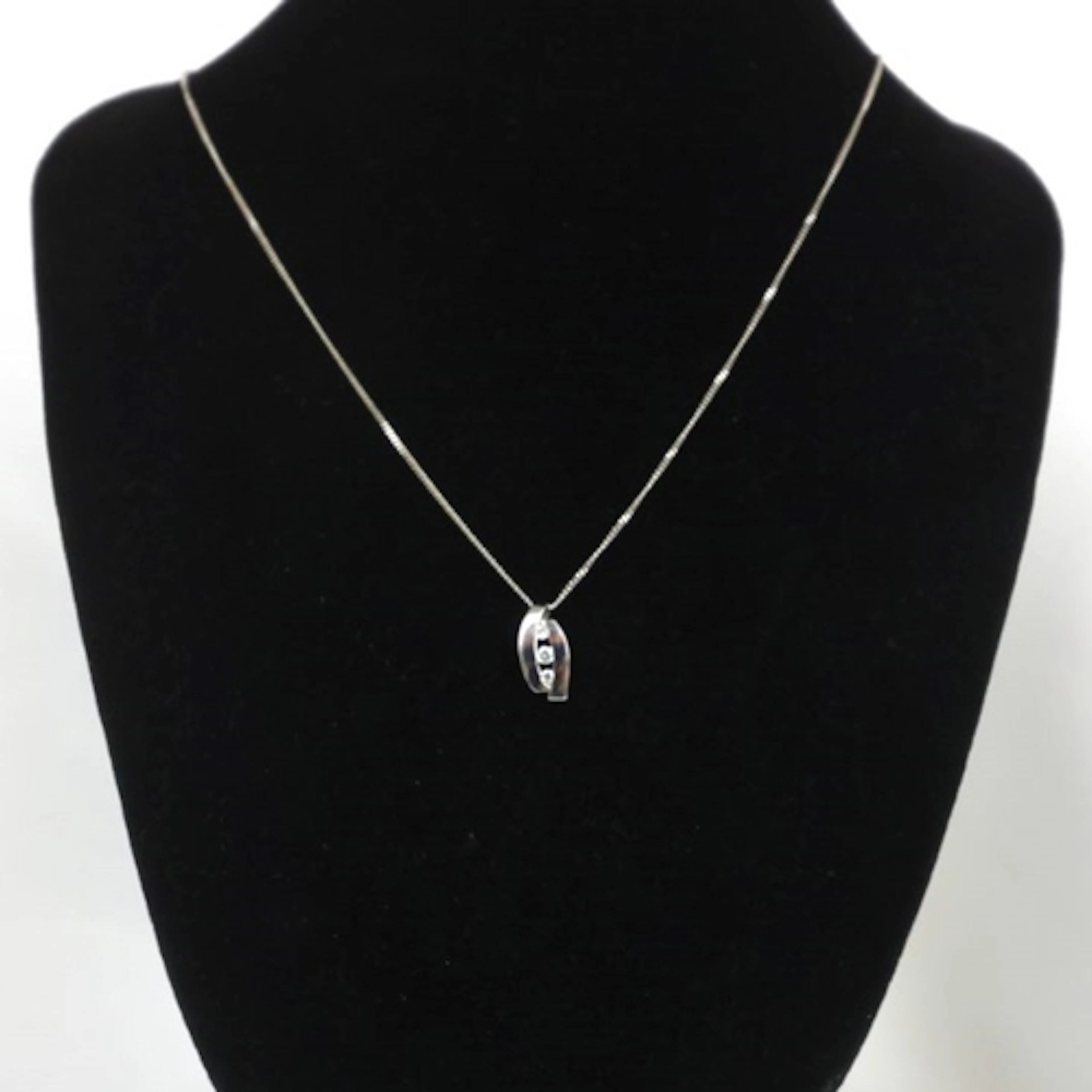 A contemporary 9ct white gold pendant, the openwork pendant ...