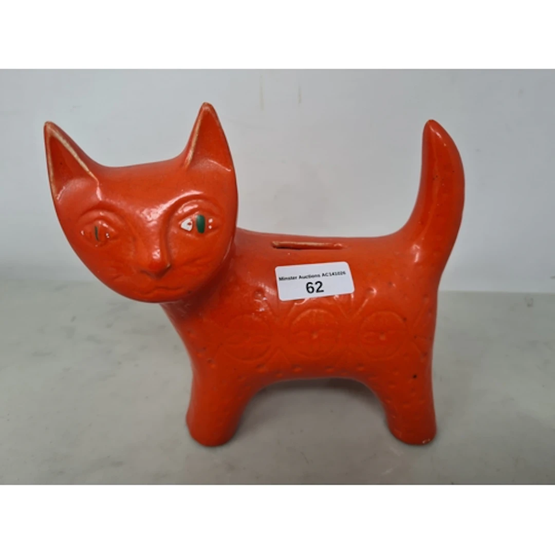 A Jema Holland pottery Cat Money Box with orange glaze havin...