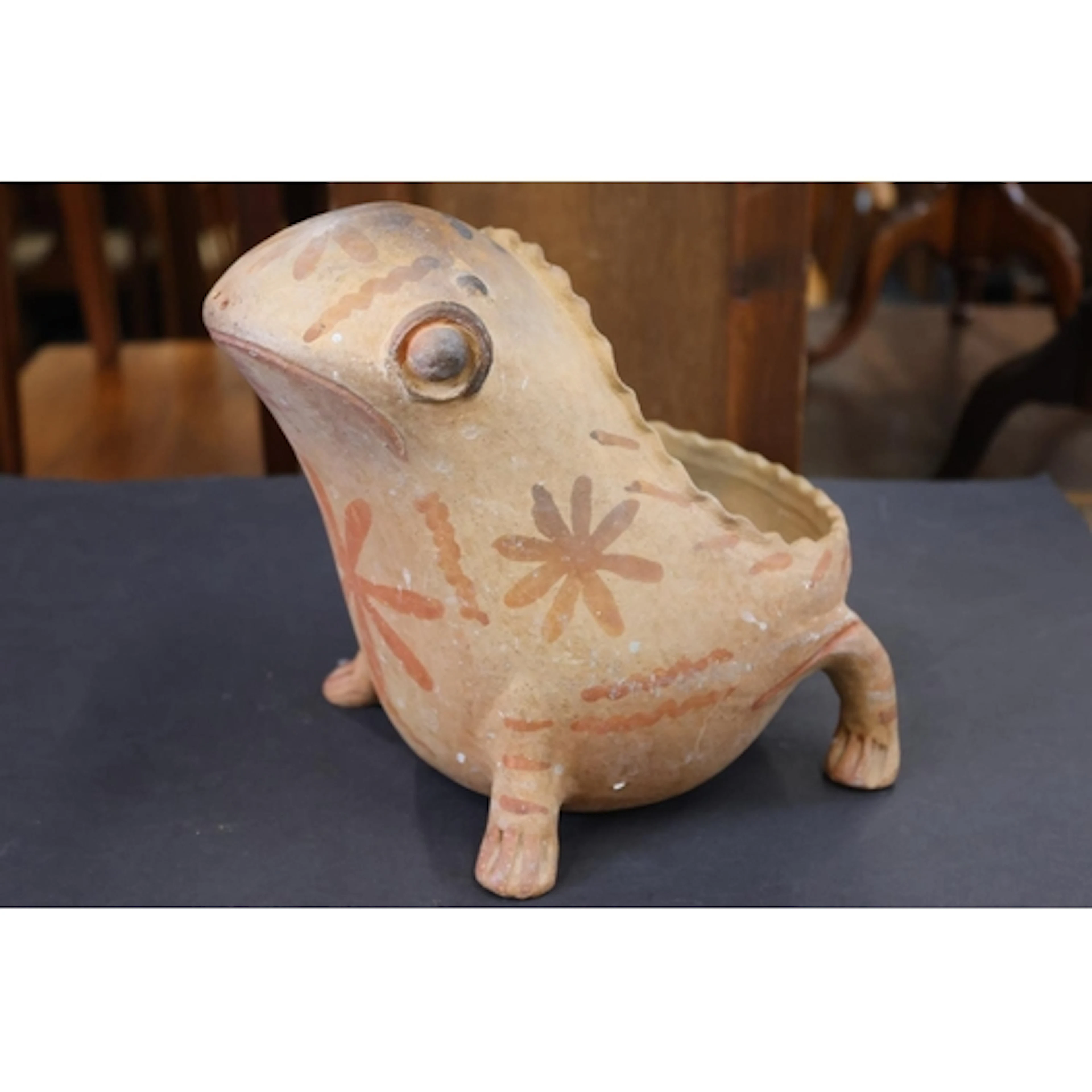 Terracotta planter in the form of a frog.