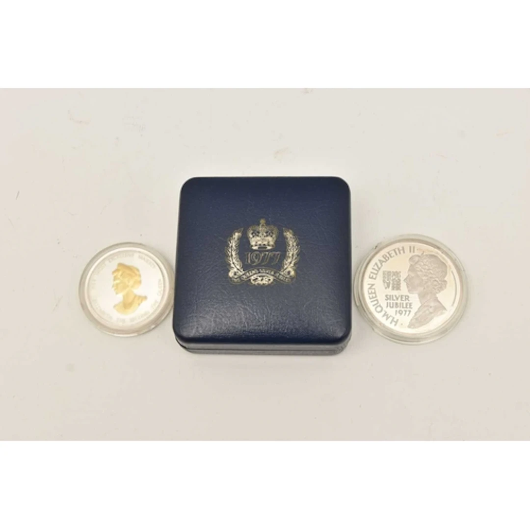 Silver. A Queen Elizabeth II Proof Silver Jubilee medallion ...