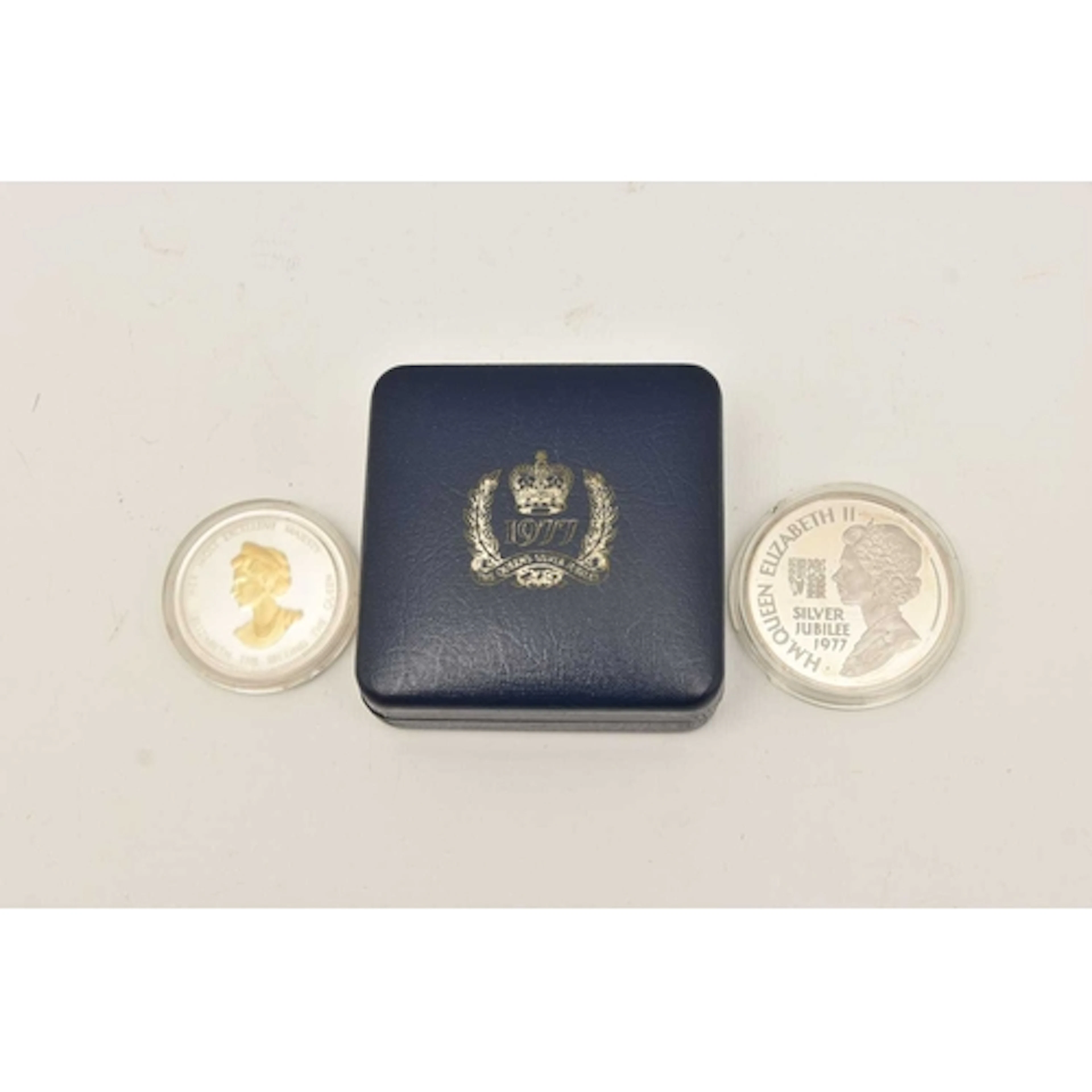 Silver. A Queen Elizabeth II Proof Silver Jubilee medallion ...