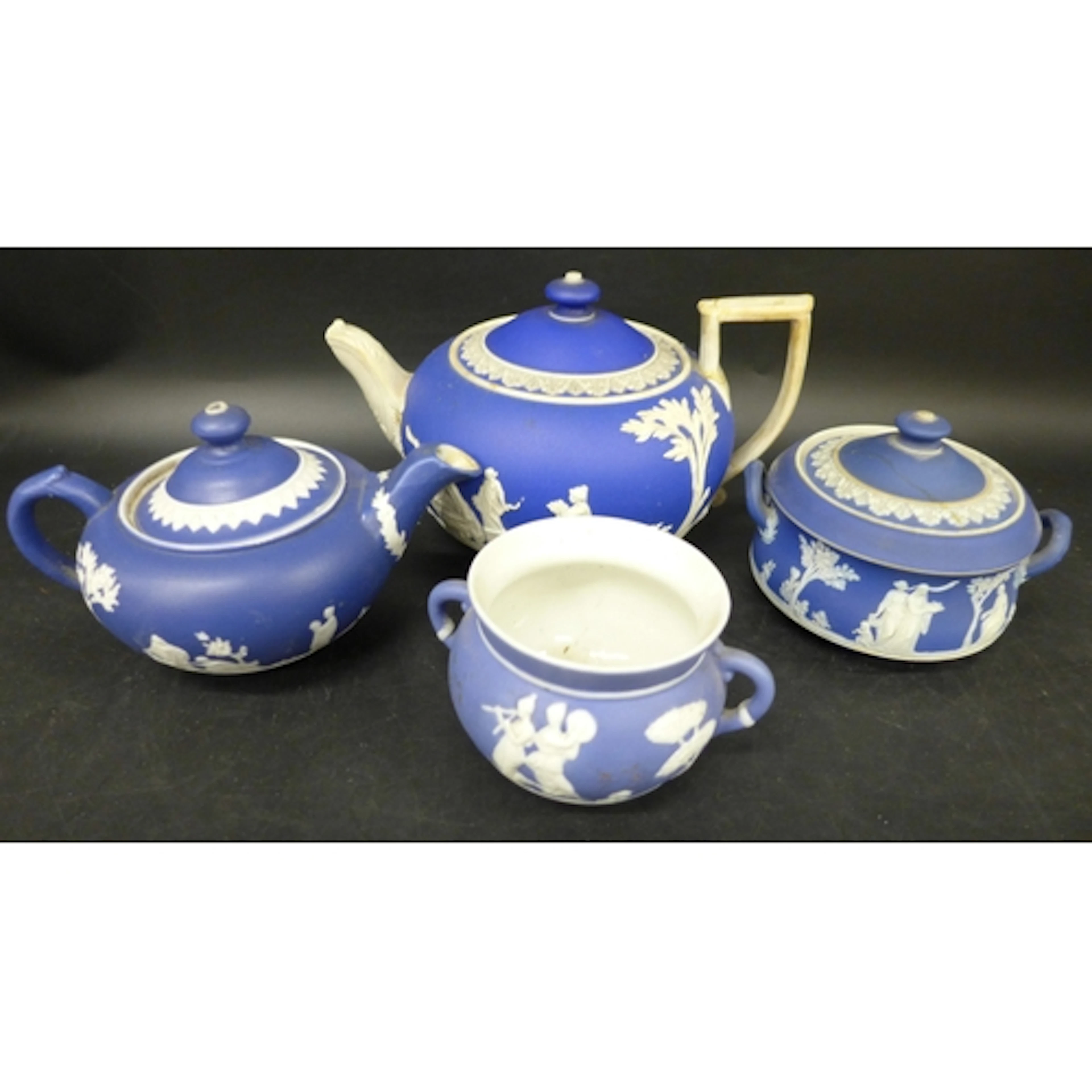 Four pieces of Wedgwood Jasperware (a/f), cobalt blue with w...