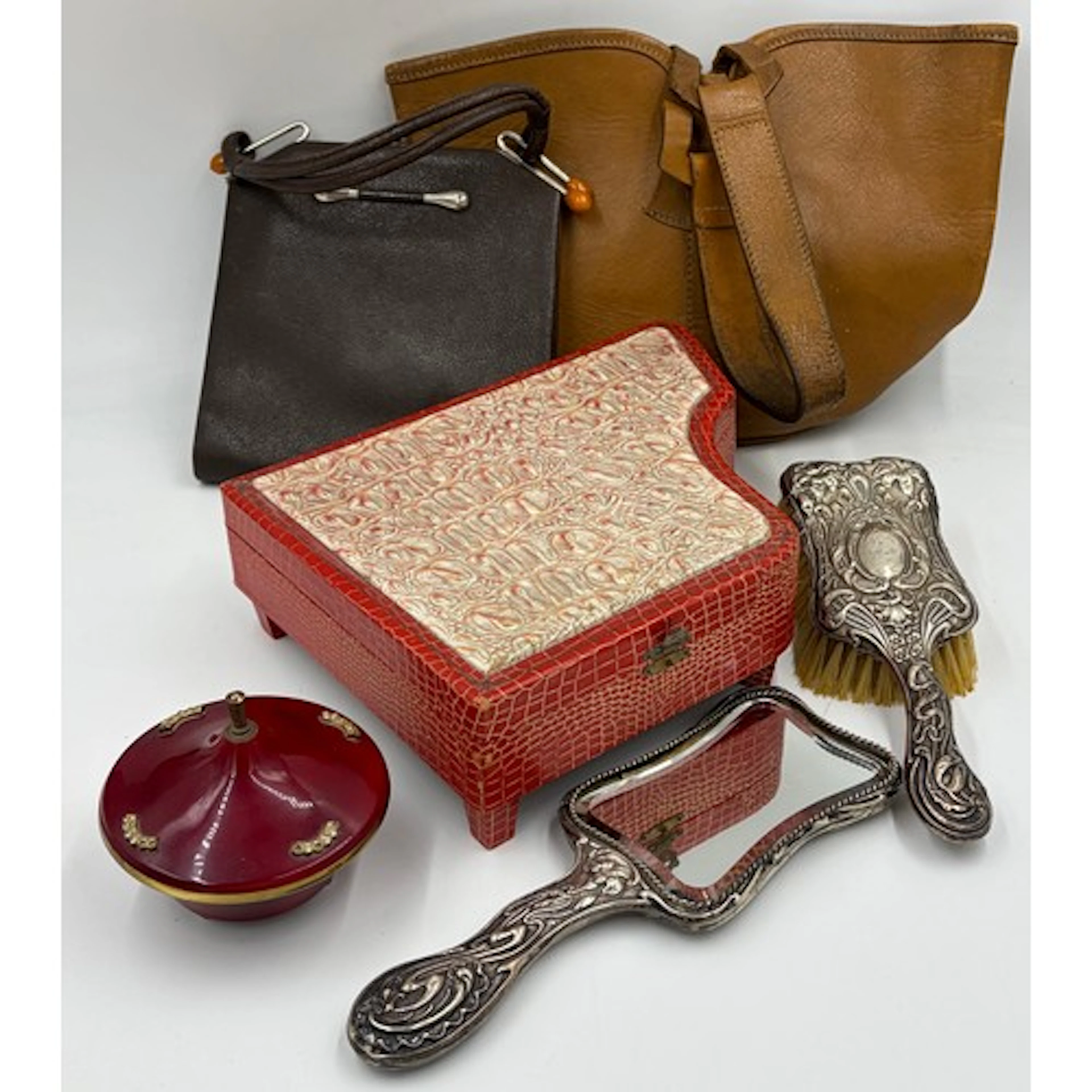 A miscellany to include two vintage handbags, a faux crocodi...