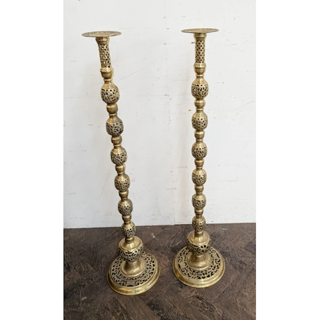 Monumental pair of pierced brass floor standing Indian candl...