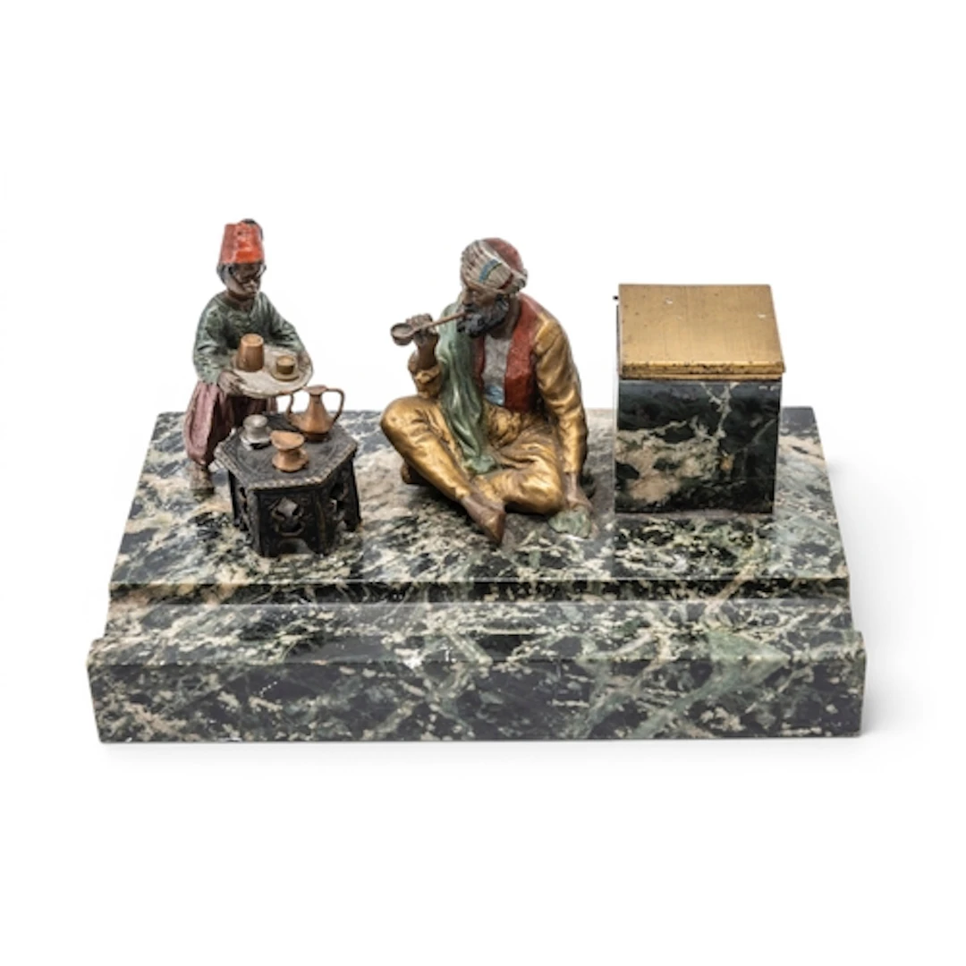 AN AUSTRIAN COLD PAINTED BRONZE and marble desk stand with a...