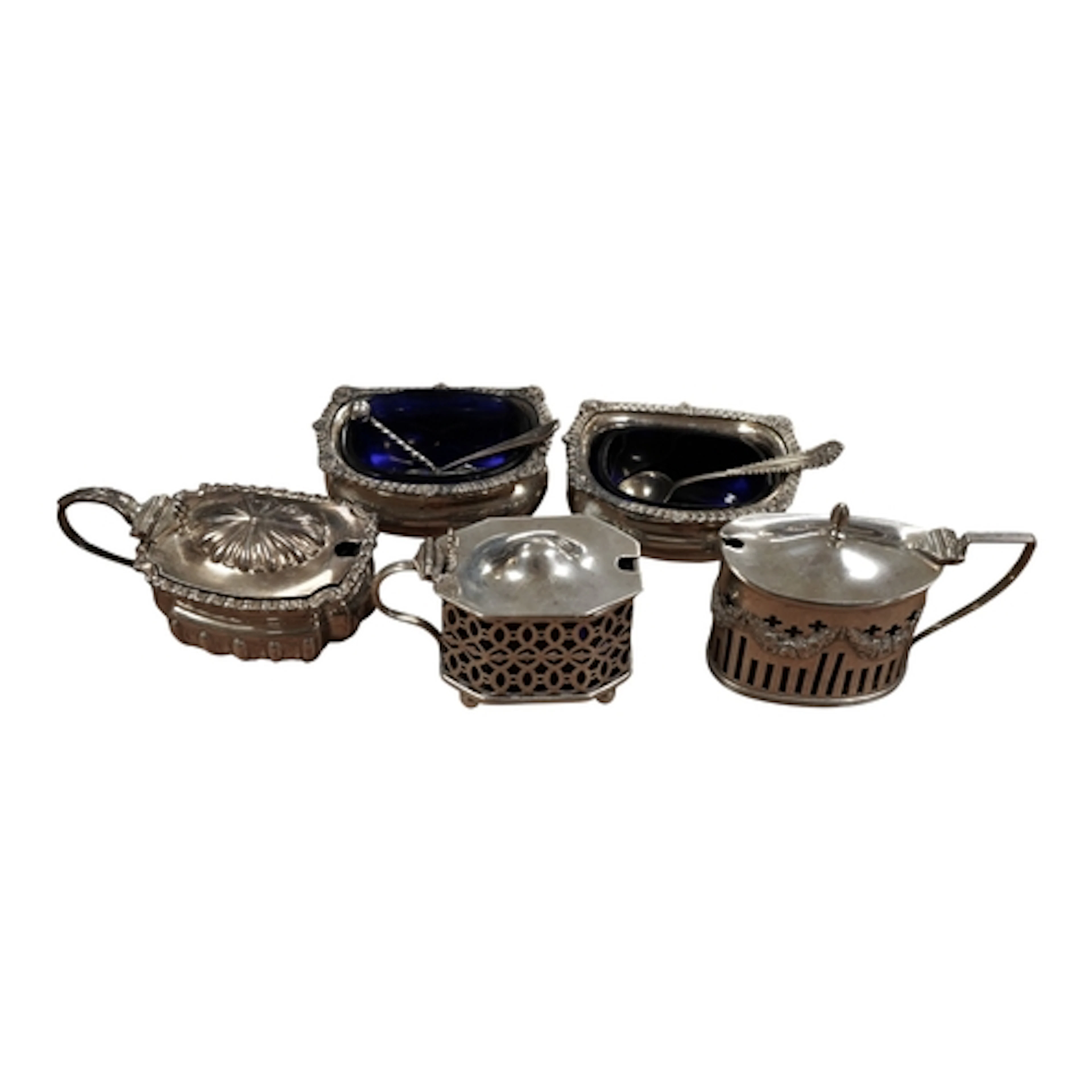 Three assorted silver mustard pots including pierced oval, B...