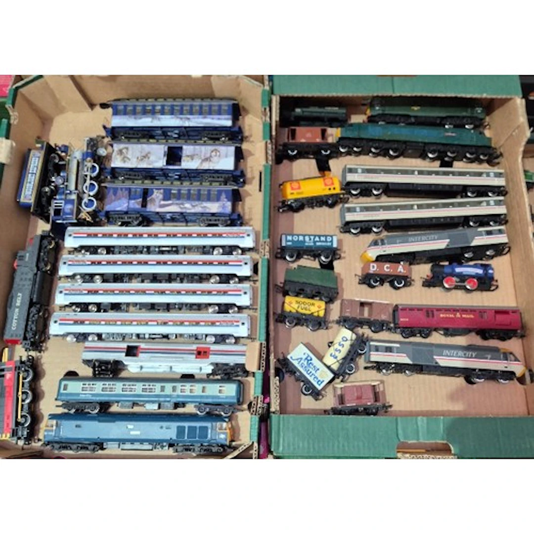 Two boxes of assorted model train items to include engines, ...