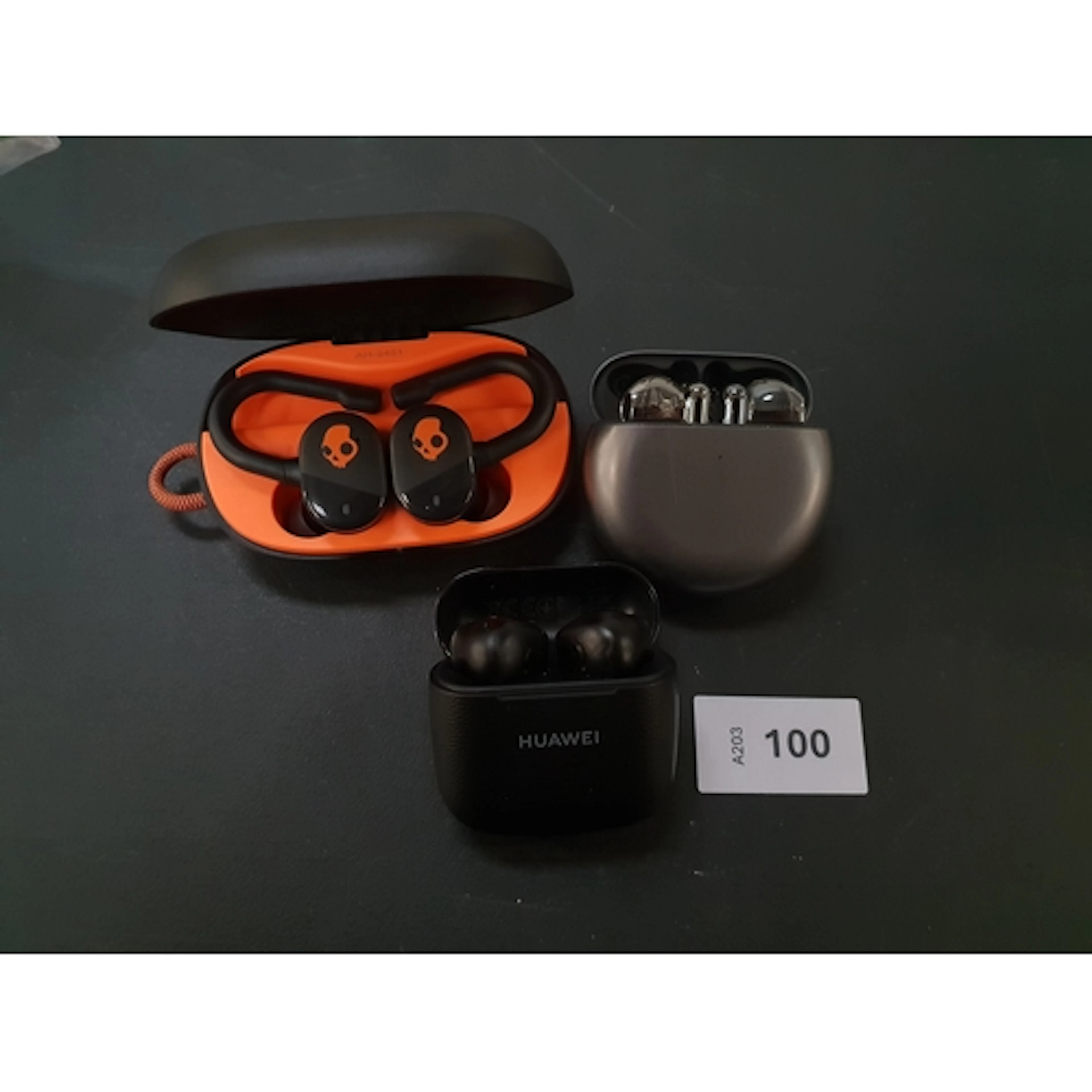 THREE PAIRS OF EARBUDS including Skullcandy and Huawei