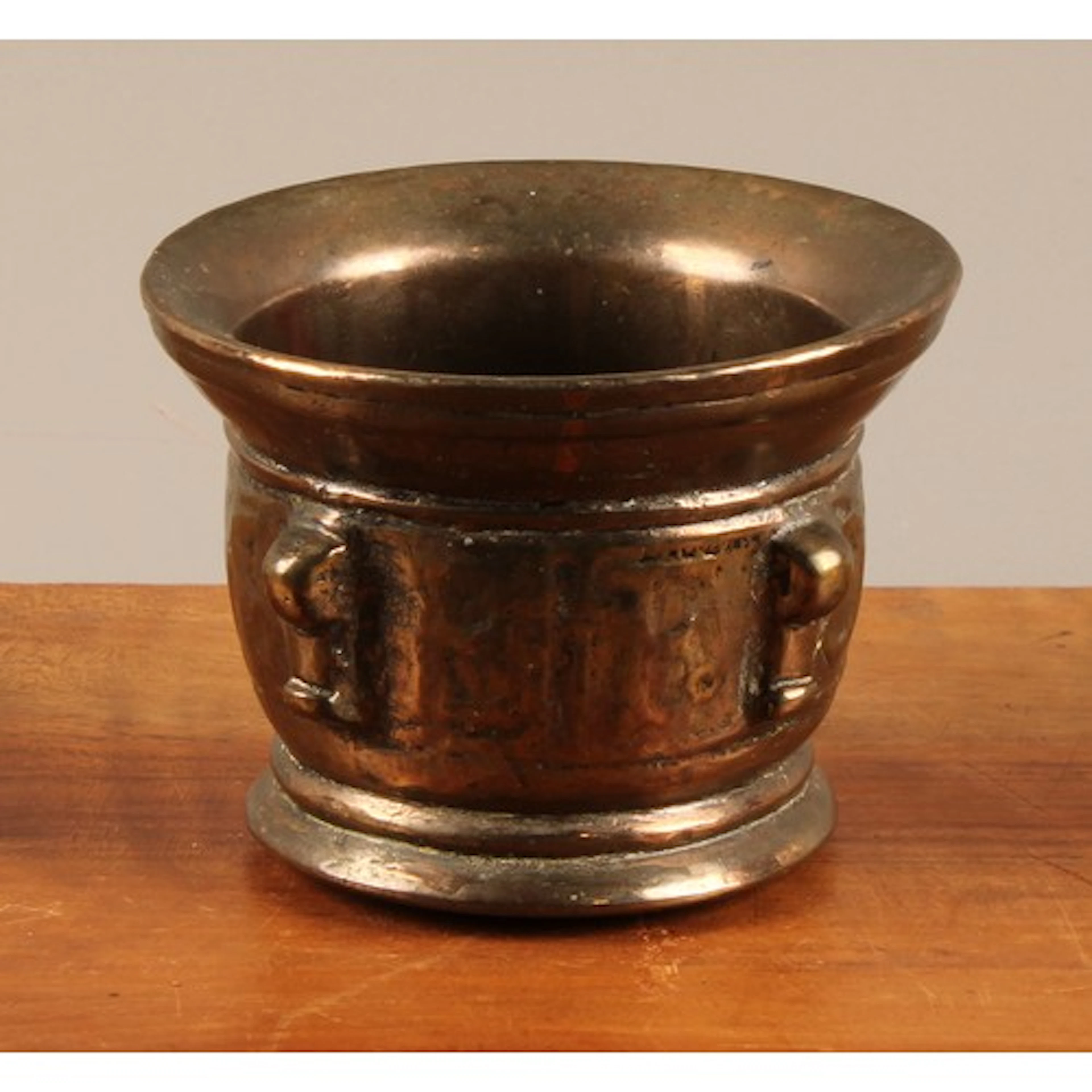 An 18th century bronze apothecary mortar, cast lug handles, ...