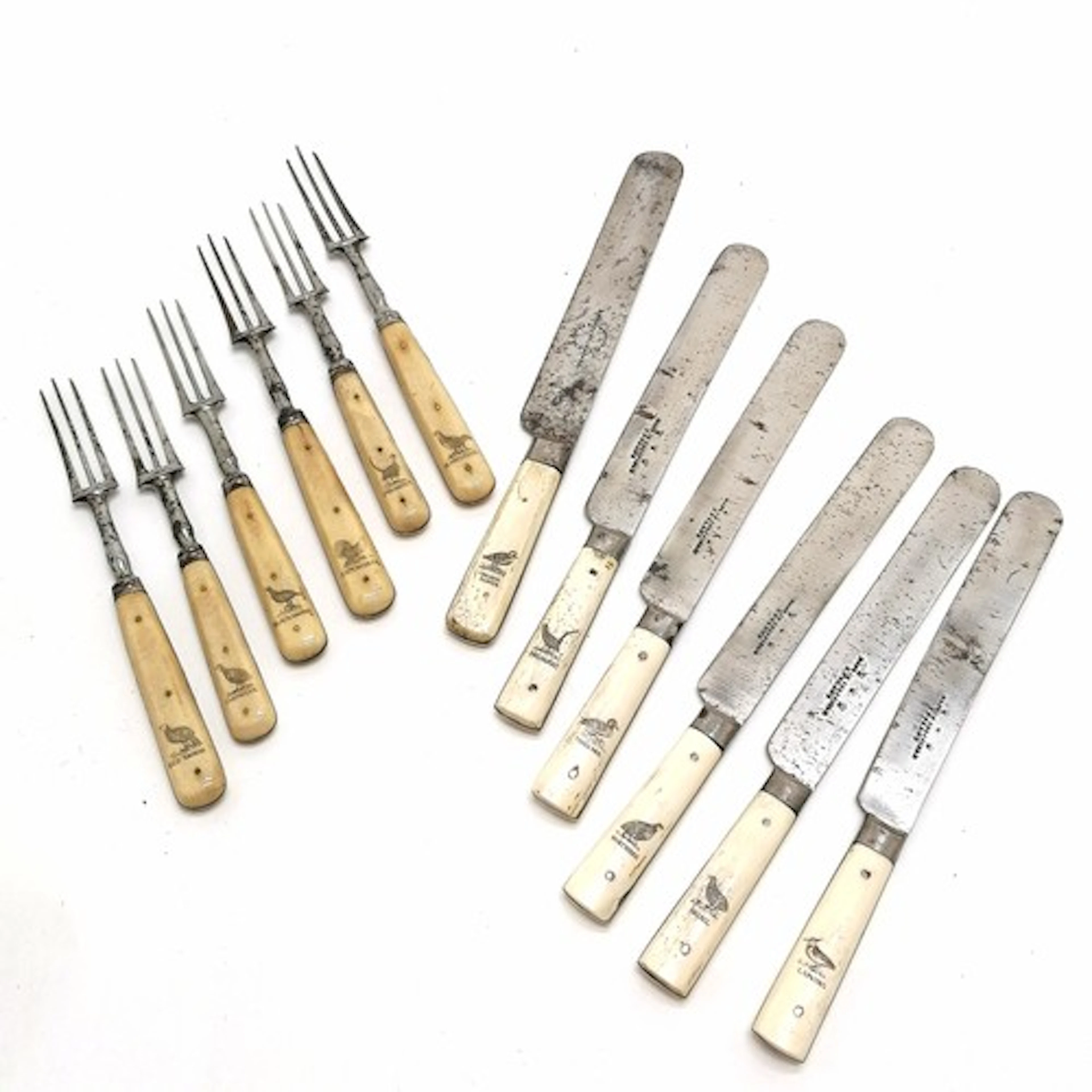 Antique matched set of knives / forks with scrimshaw bone ha...