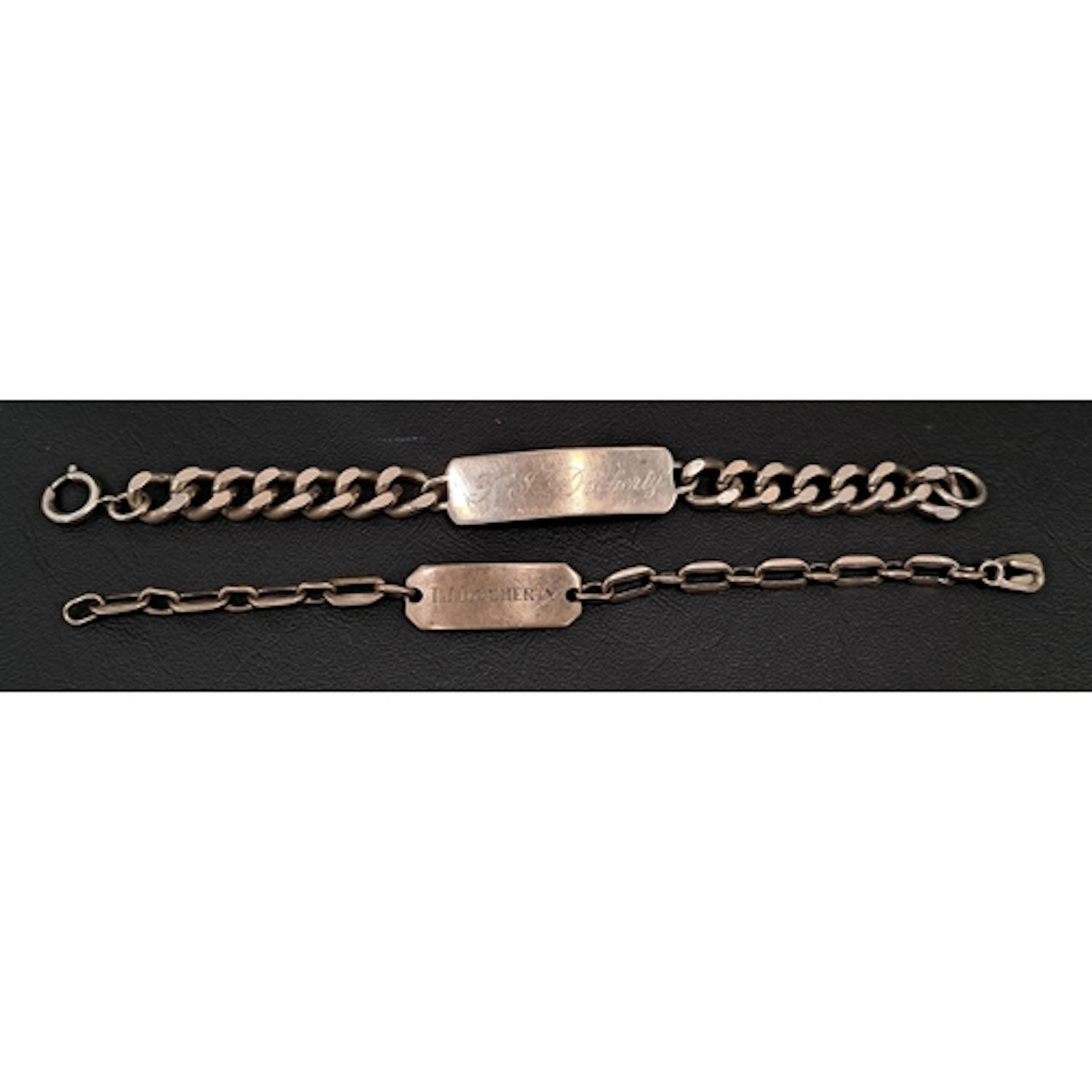 HEAVY SILVER IDENTITY BRACELET the panel engraved 'T. F. Doc...