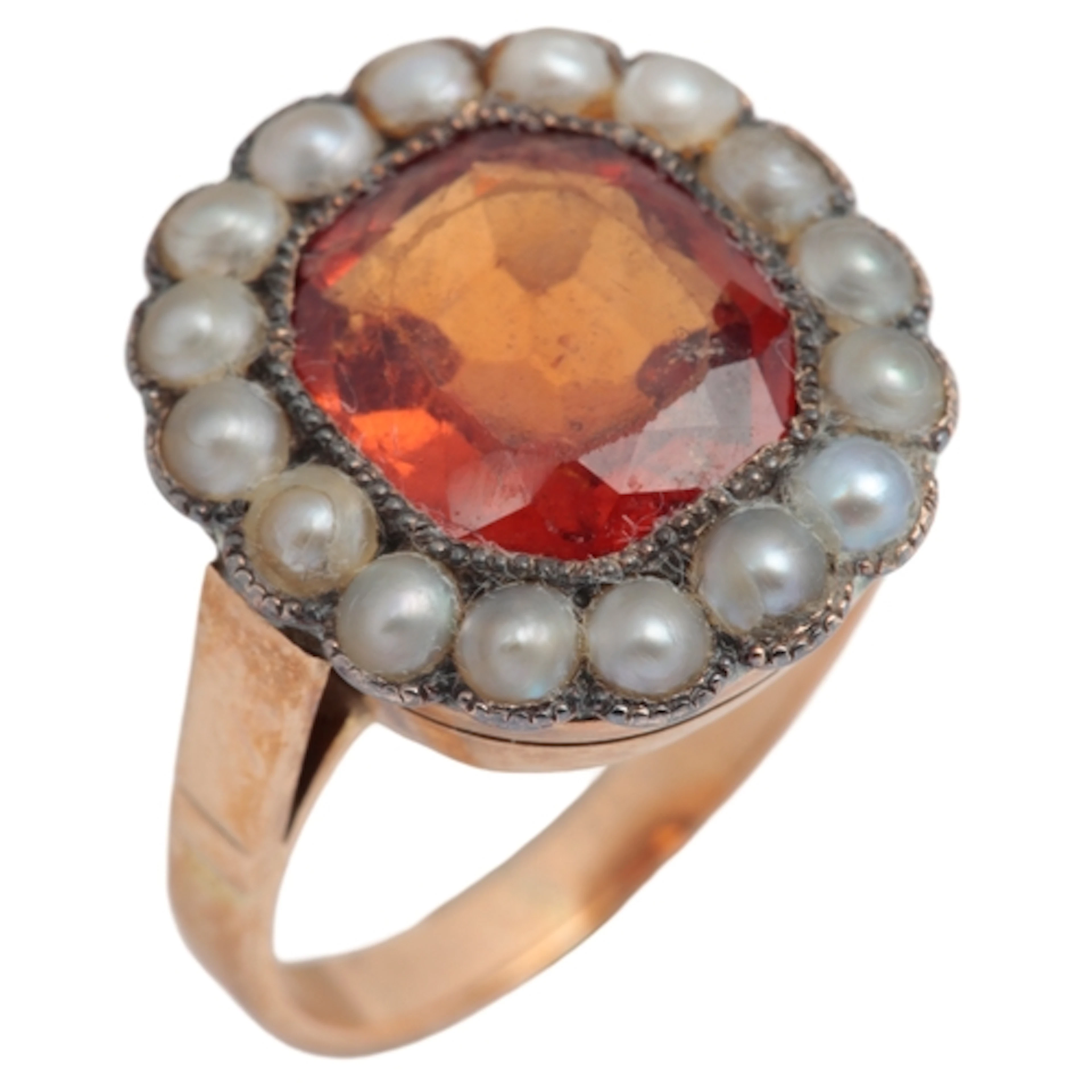 A hessonite garnet and pearl ring, mid 20th century, set wit...