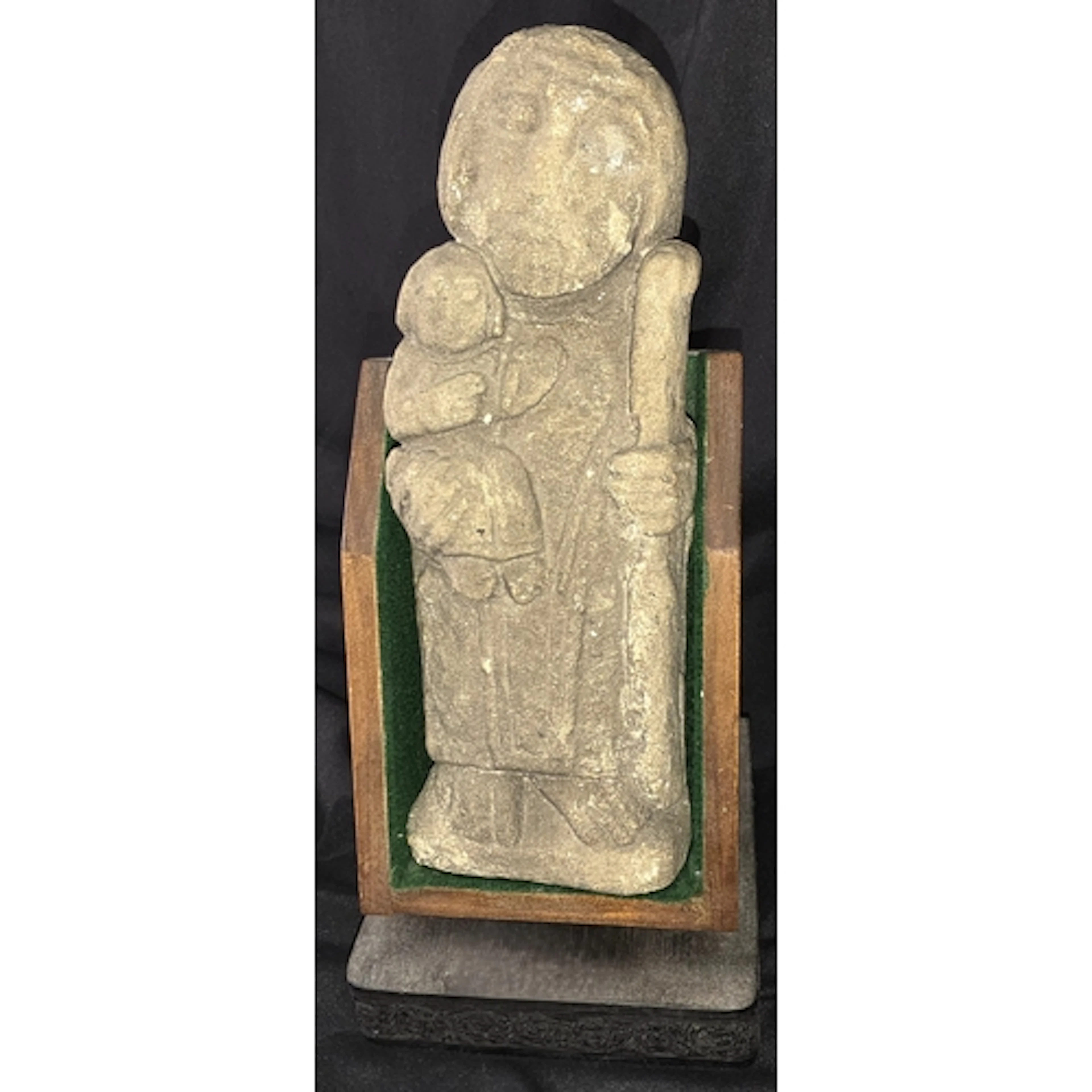 An antique religious stoneware carving of St Christopher wit...
