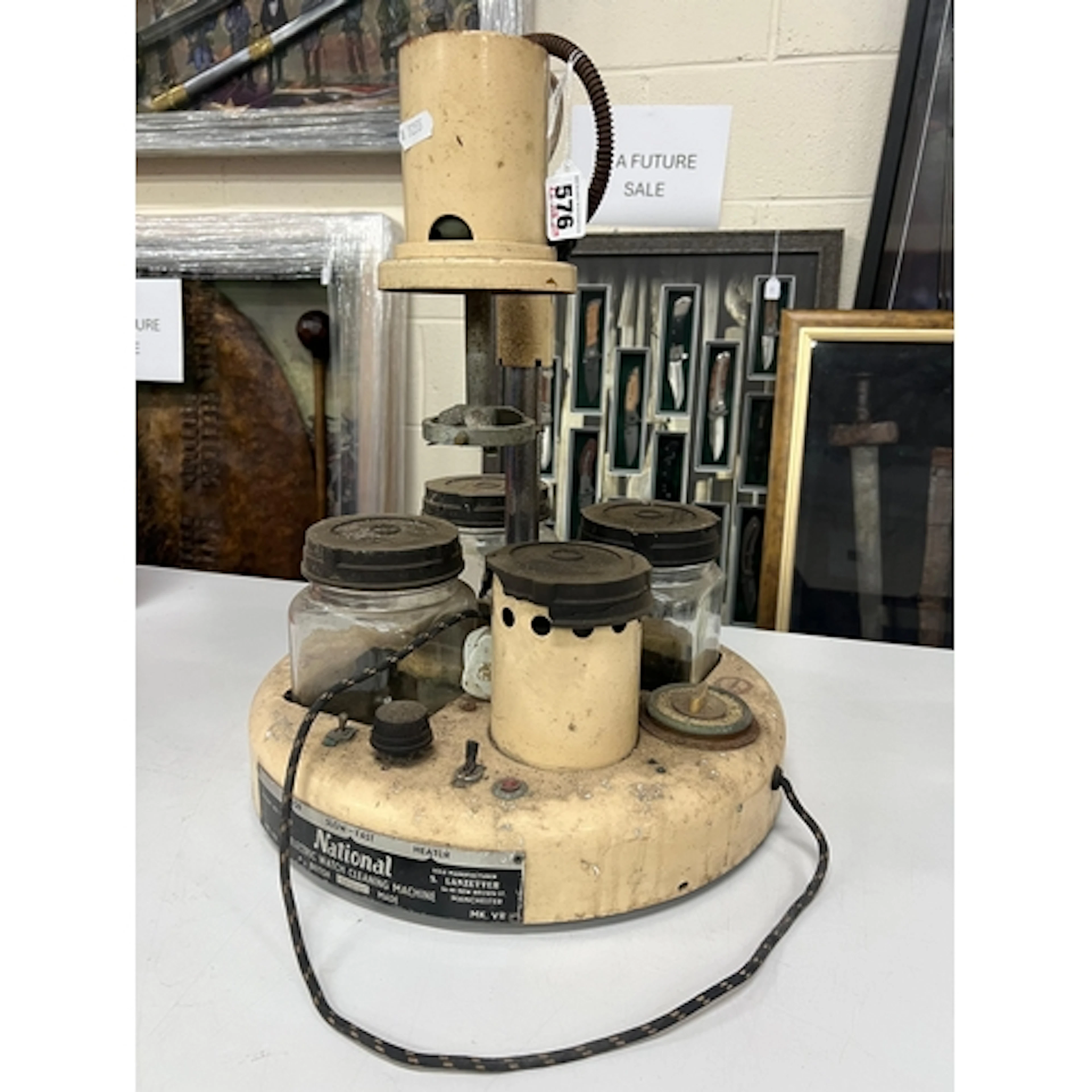 A NATIONAL ELECTRIC WATCH CLEANING MACHINE, with three screw...