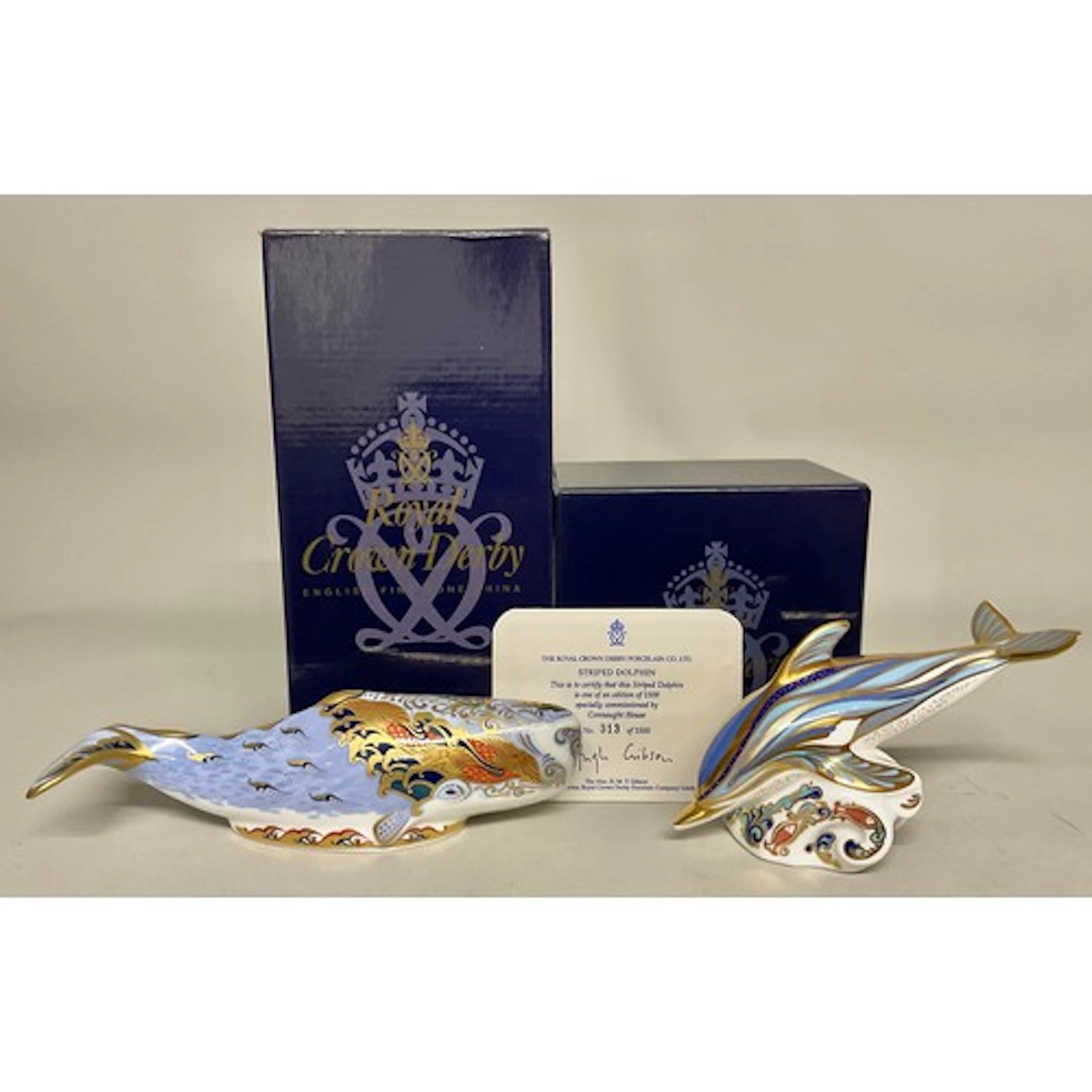 A Royal Crown Derby paperweight, Striped Dolphin, designed b...